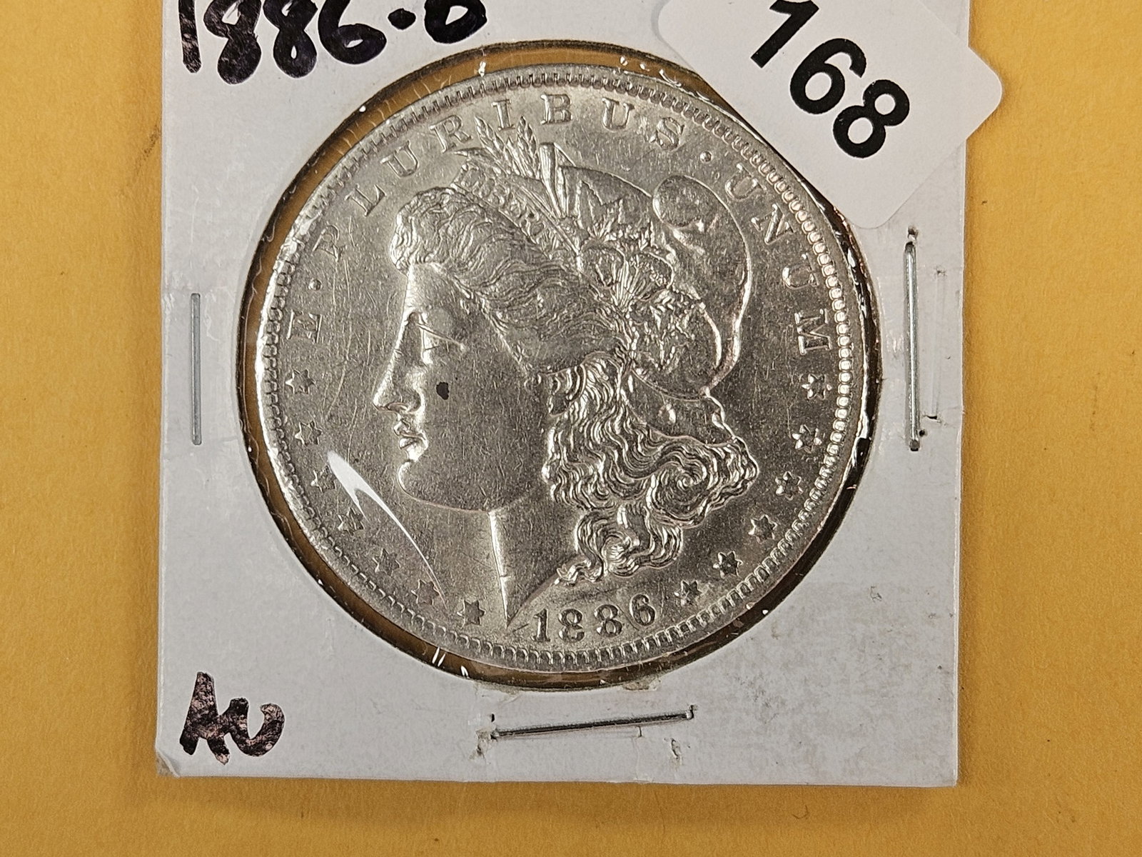 Better 1886-O Morgan Dollar in About Uncirculated (1 of 2)