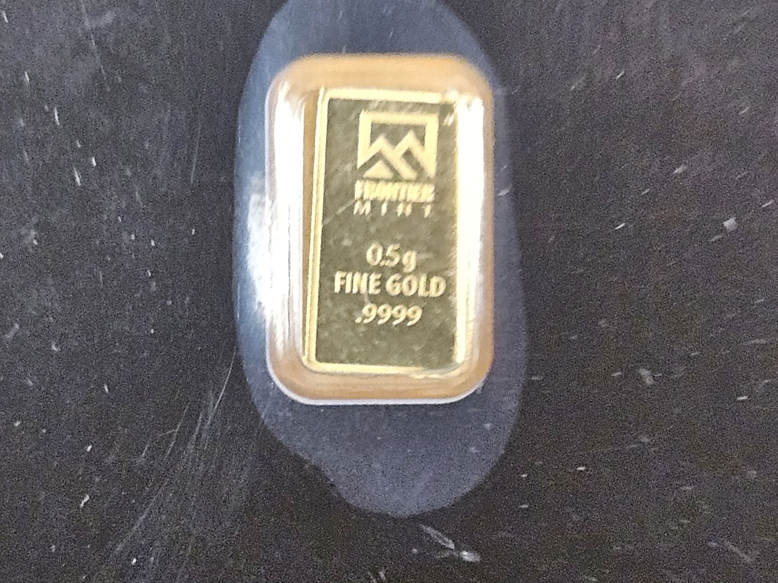 GOLD! Frontier Mint .5 gram .9999 fine gold bar: In assay holder. Half-Gram 