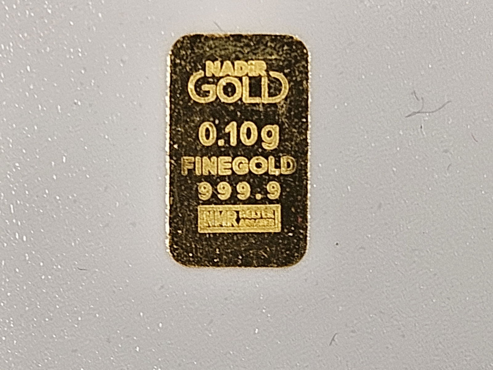 GOLD! KARATBARS .1 gram .9999 fine gold bar: In advertising card. Point one gram (.1)