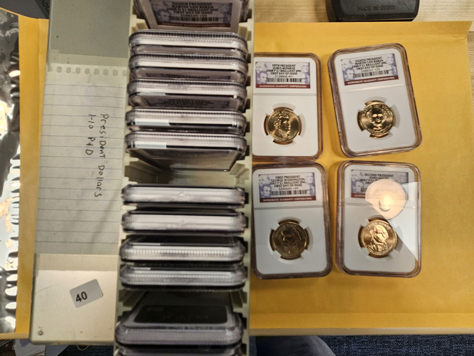 FULL NGC slab box of Graded Presidential Dollars: Mixed. All Brilliant Uncirculated. All first day of issue 