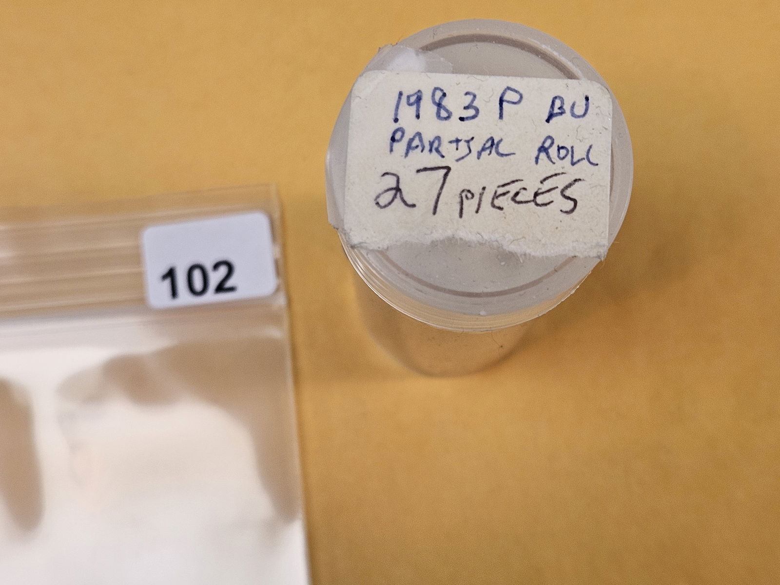 Semi-Key Roll of Brilliant Uncirculated 1983 Washington Quarters: Note says "27 pieces". From an old collection. Unchecked by us