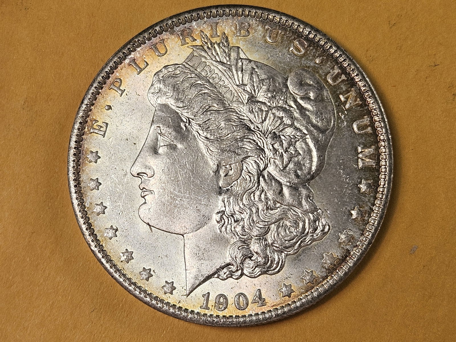 Very Choice Brilliant Uncirculated 1904-O Morgan silver Dollar: Beautiful toning! 