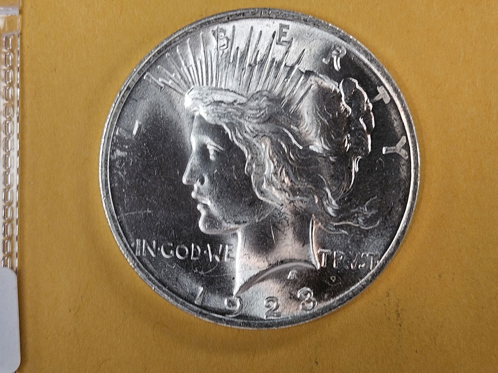 Very Choice Brilliant Uncirculated 1923 Peace silver Dollar: Roll fresh with deep contrast! 