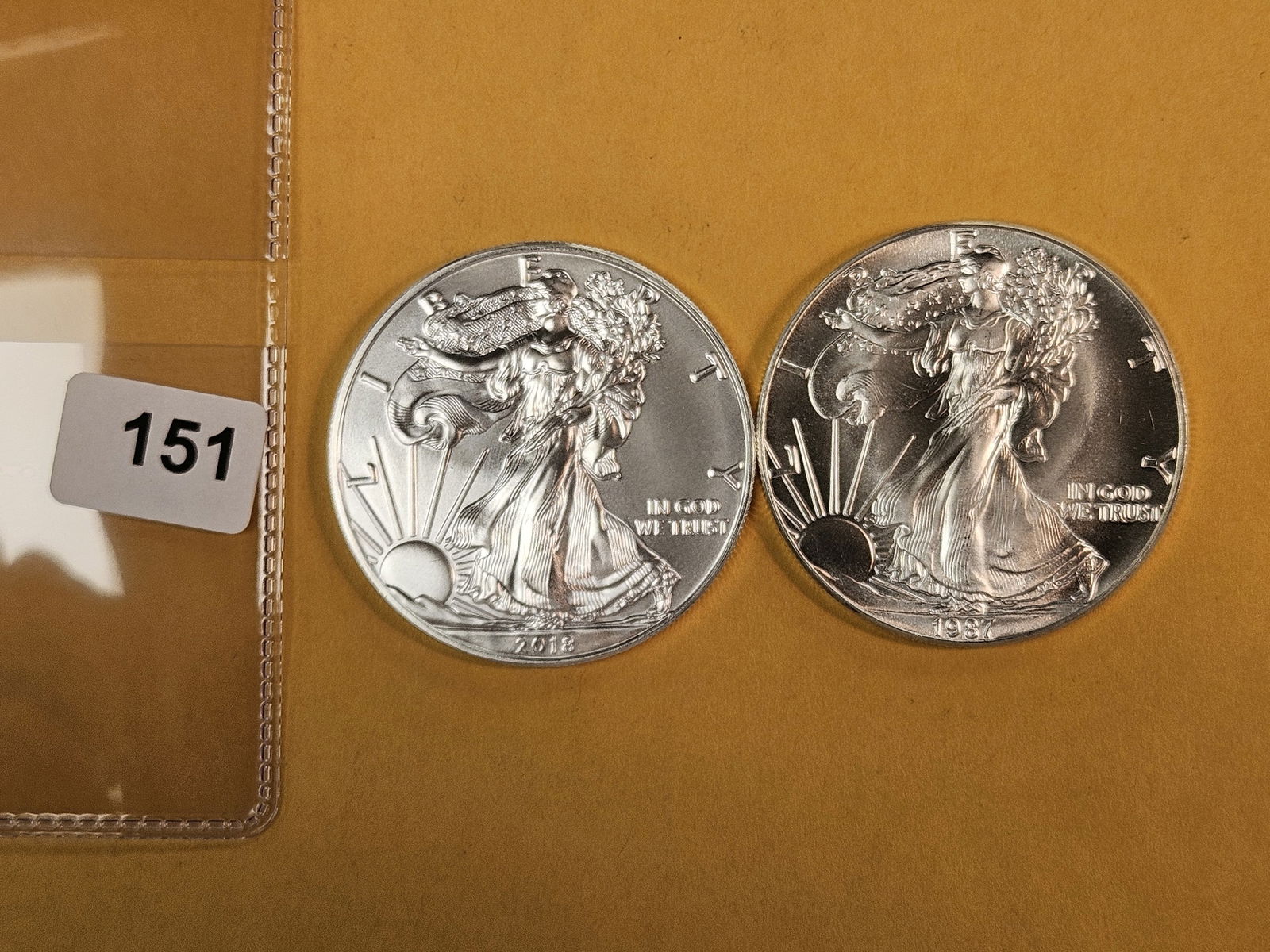 Two GEM Brilliant Uncirculated American Silver Eagles: 2018 and 1987 