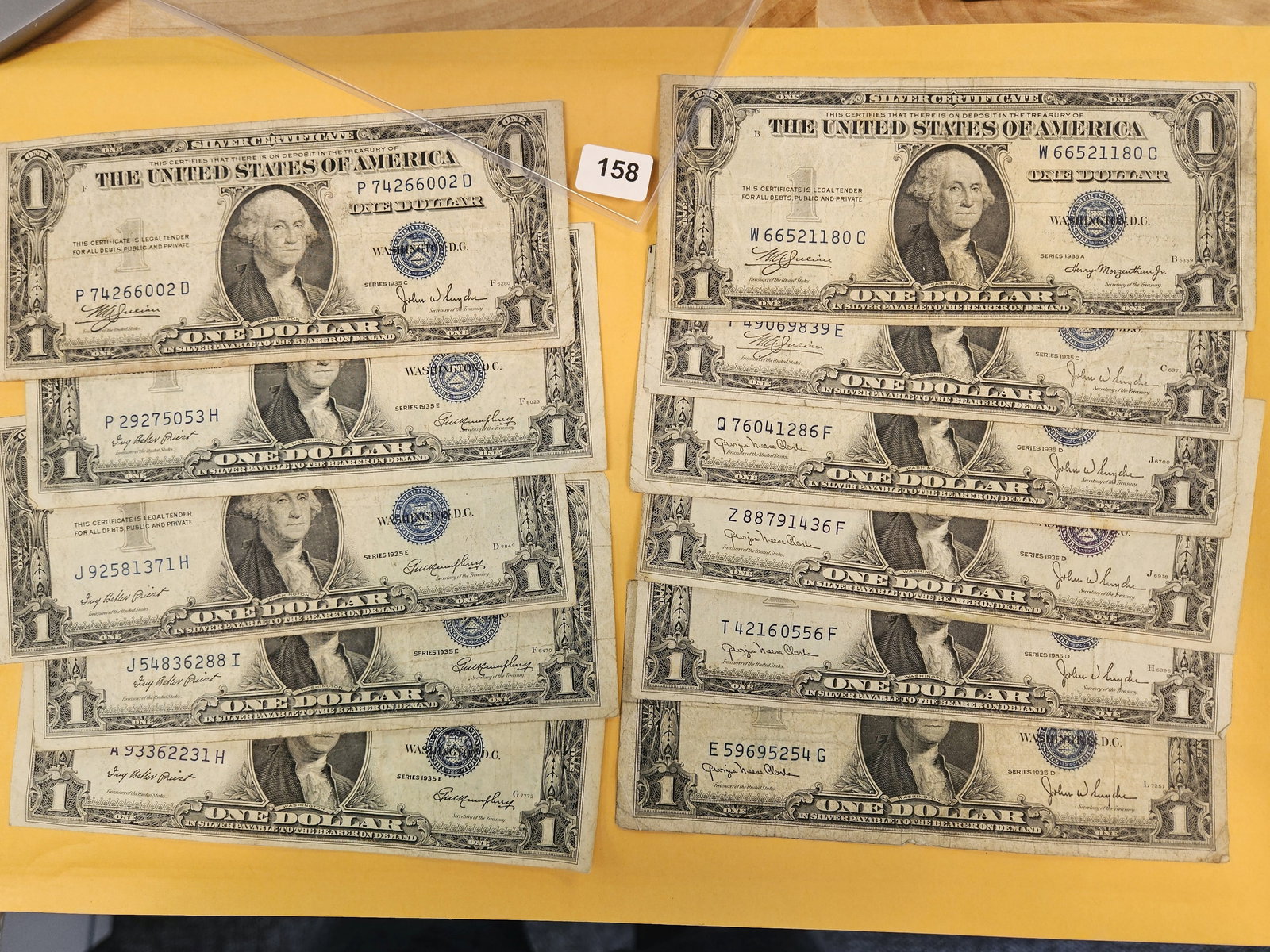 Eleven mixed 1935 One Dollar Silver Certificates: All circulated 