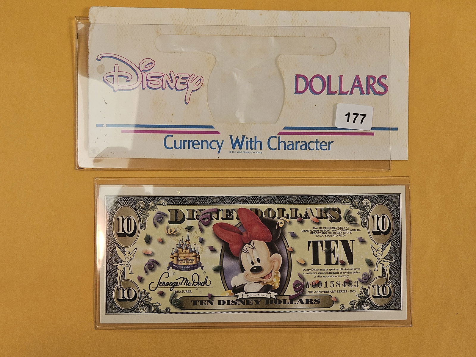 DISNEY DOLLAR!: Crisp Uncirculated Ten Dollars. 50th Anniversary. Minnie Mouse. Comes with Slightly used Disney Dollar Envelope