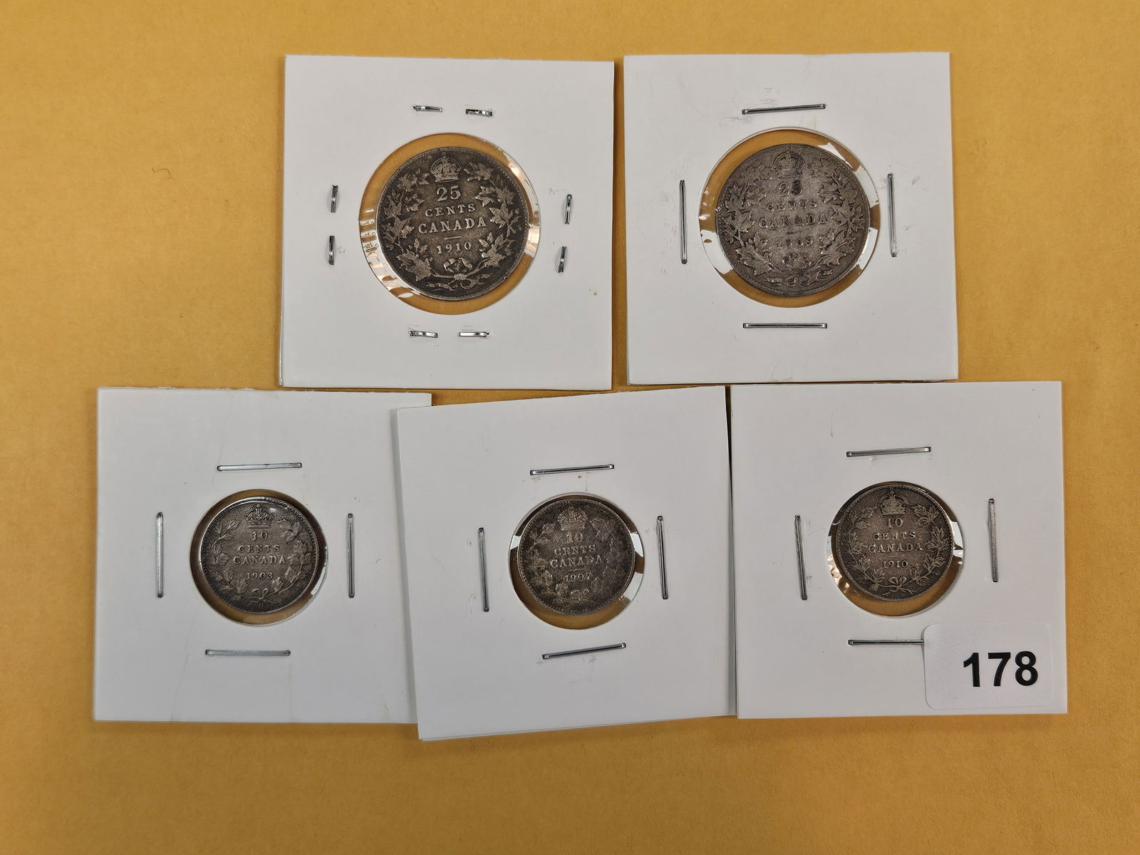 Five silver Canadian coins from the early 1900's: 10 and 25 cents. All silvers 