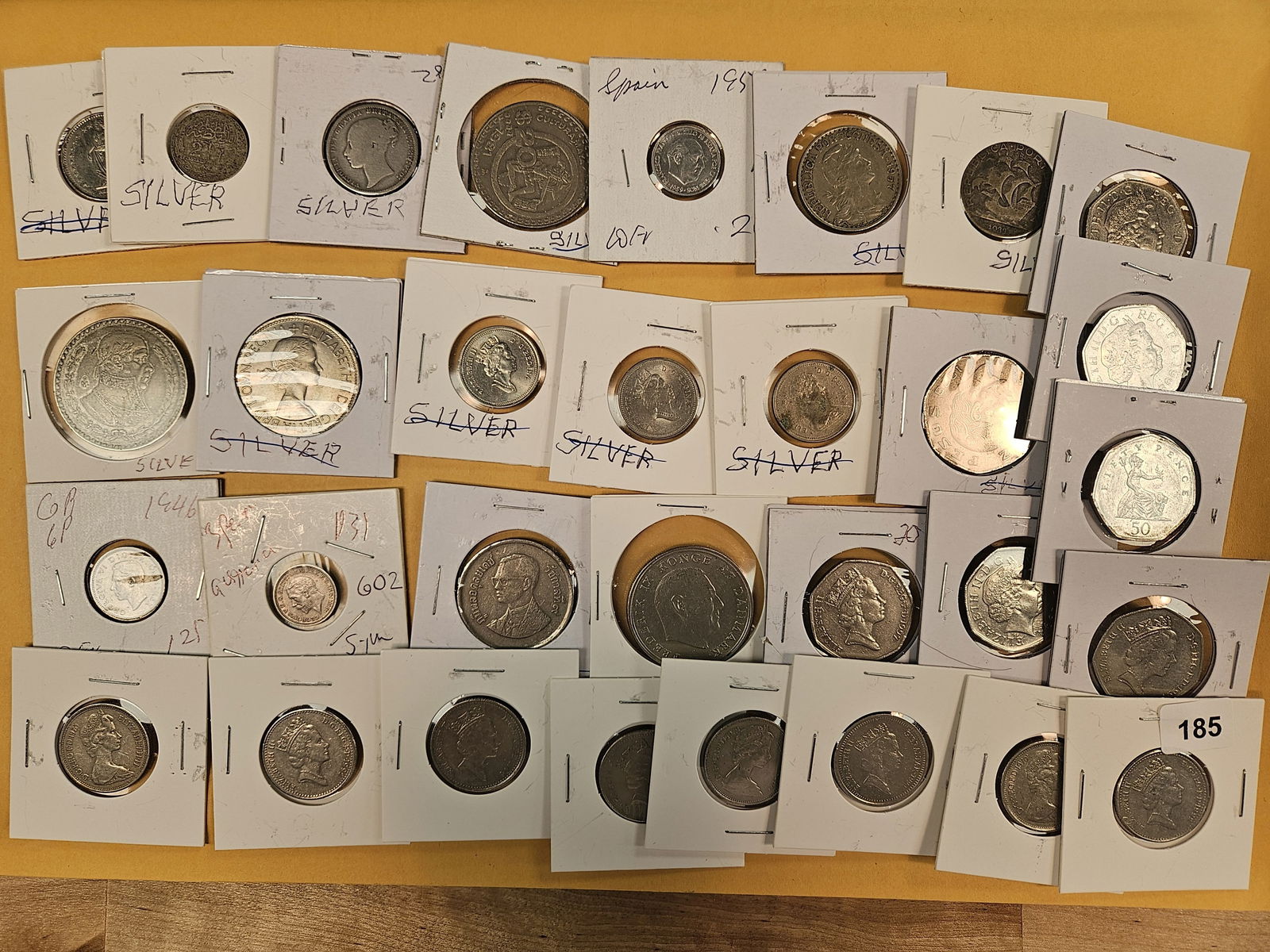 Thirty-one mixed World Coins: Some say silver on them. Most of the ones that say silver, we crossed out because they are not silver. All from consignor 