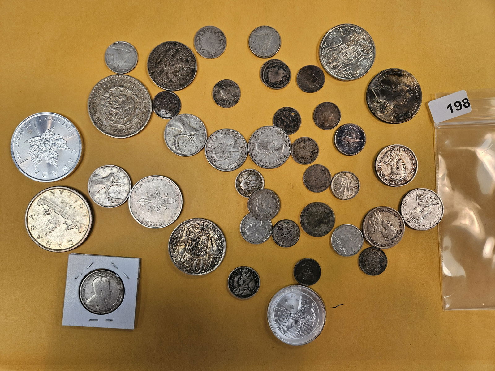 WORLD SILVER!: Bag of world silver coins. Didn't check authenticity, just know they're silver 