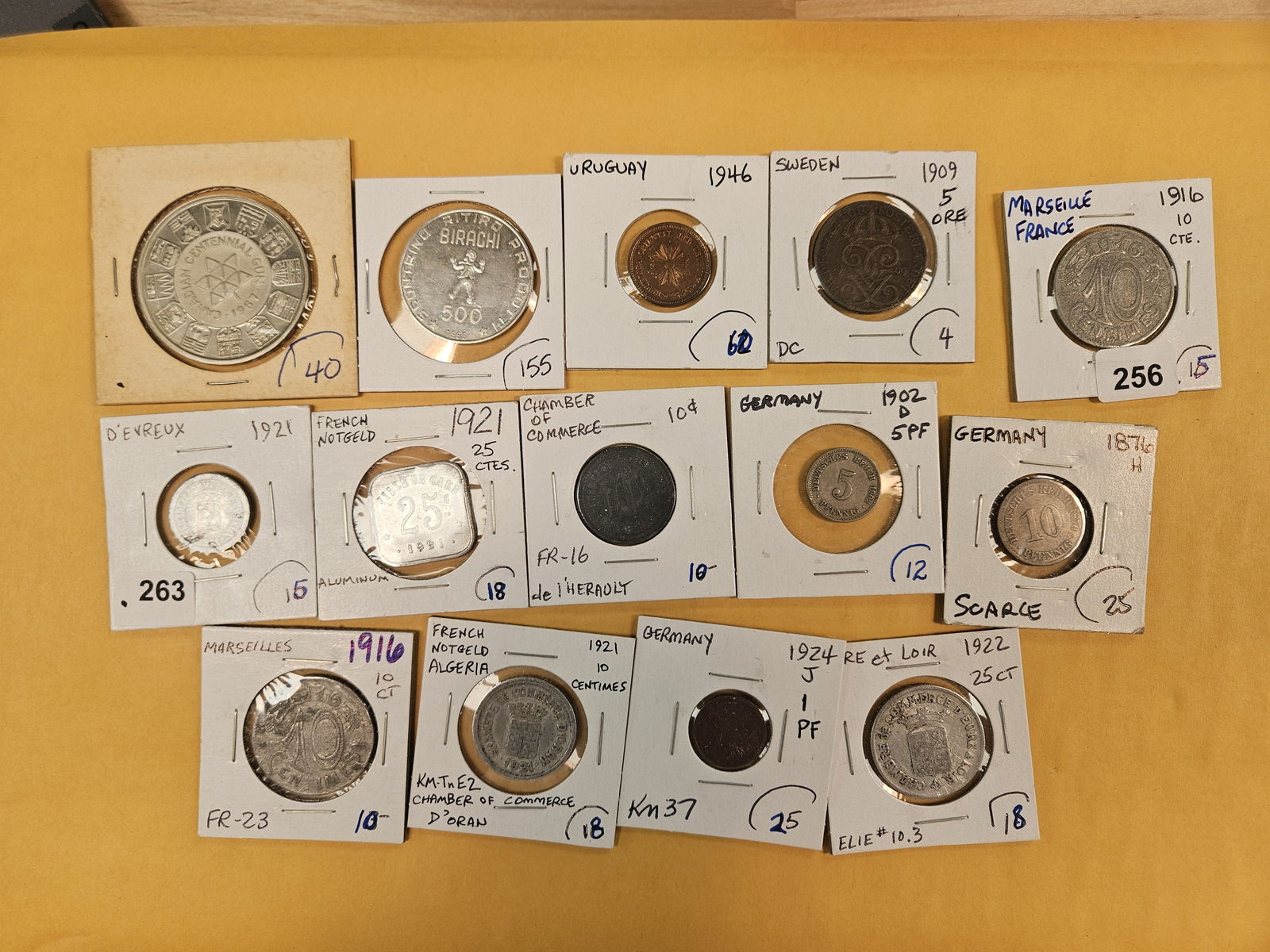 Fourteen pieces of exonumia: Tokens and world coins and other thingees 