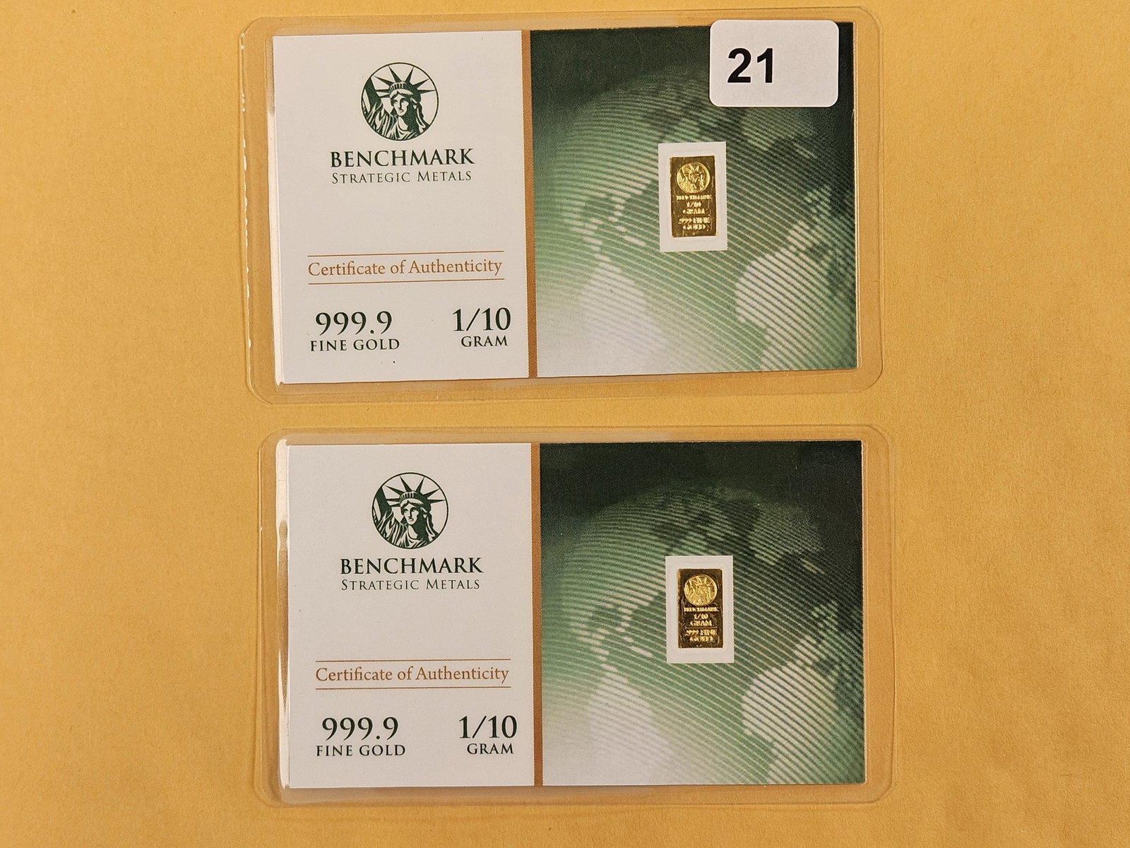 GOLD! Two One-tenth Gram .9999 fine gold bars: In original assay holders