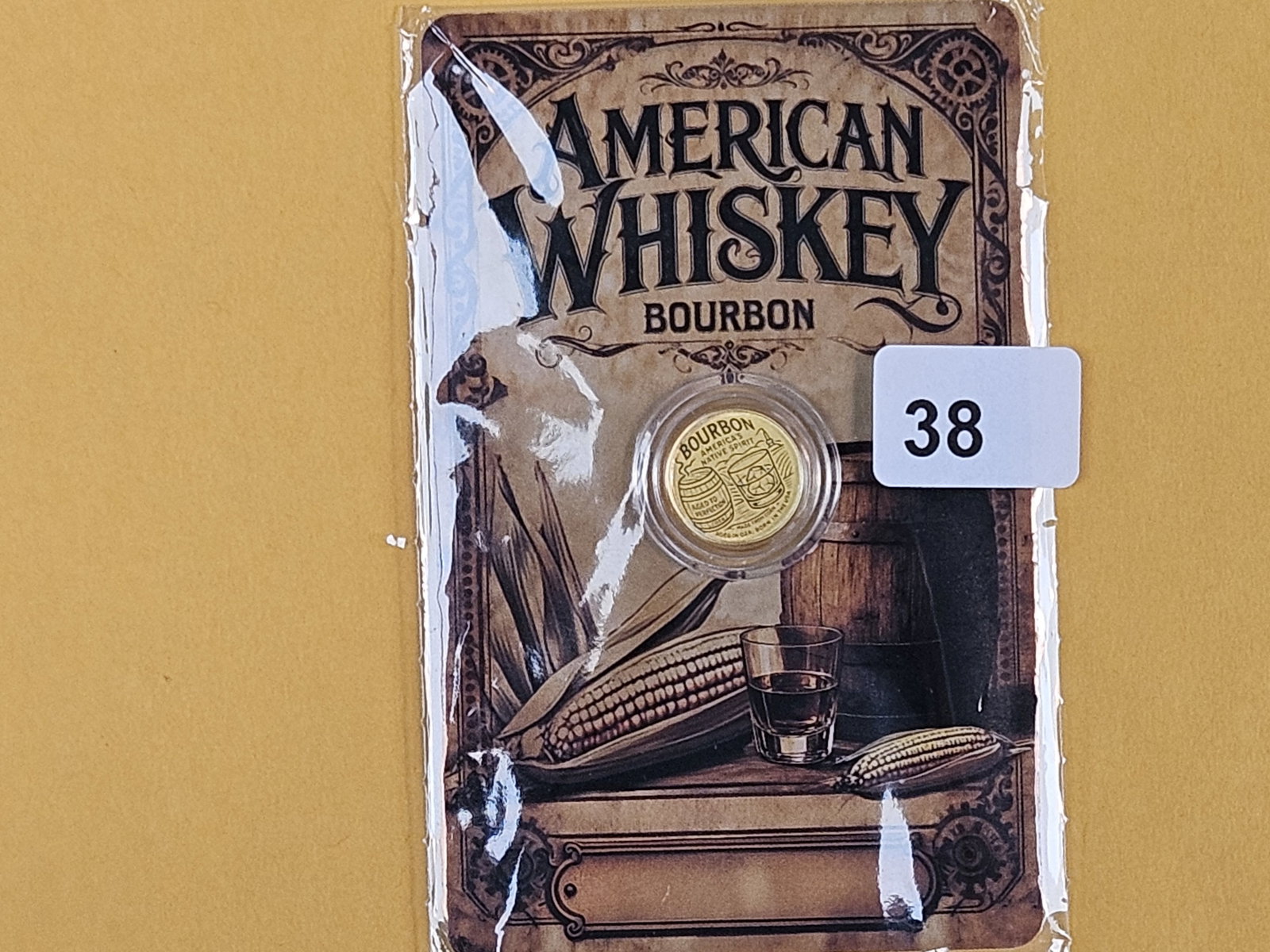 GOLD! GEM 2026 Niue Gold 50 cents: American Whiskey Bourbon design. .9999 fine gold. In assay holder