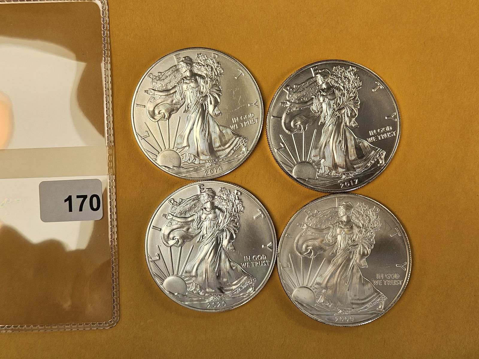 Four GEM Brilliant Uncirculated American silver Eagles: Mixed 
