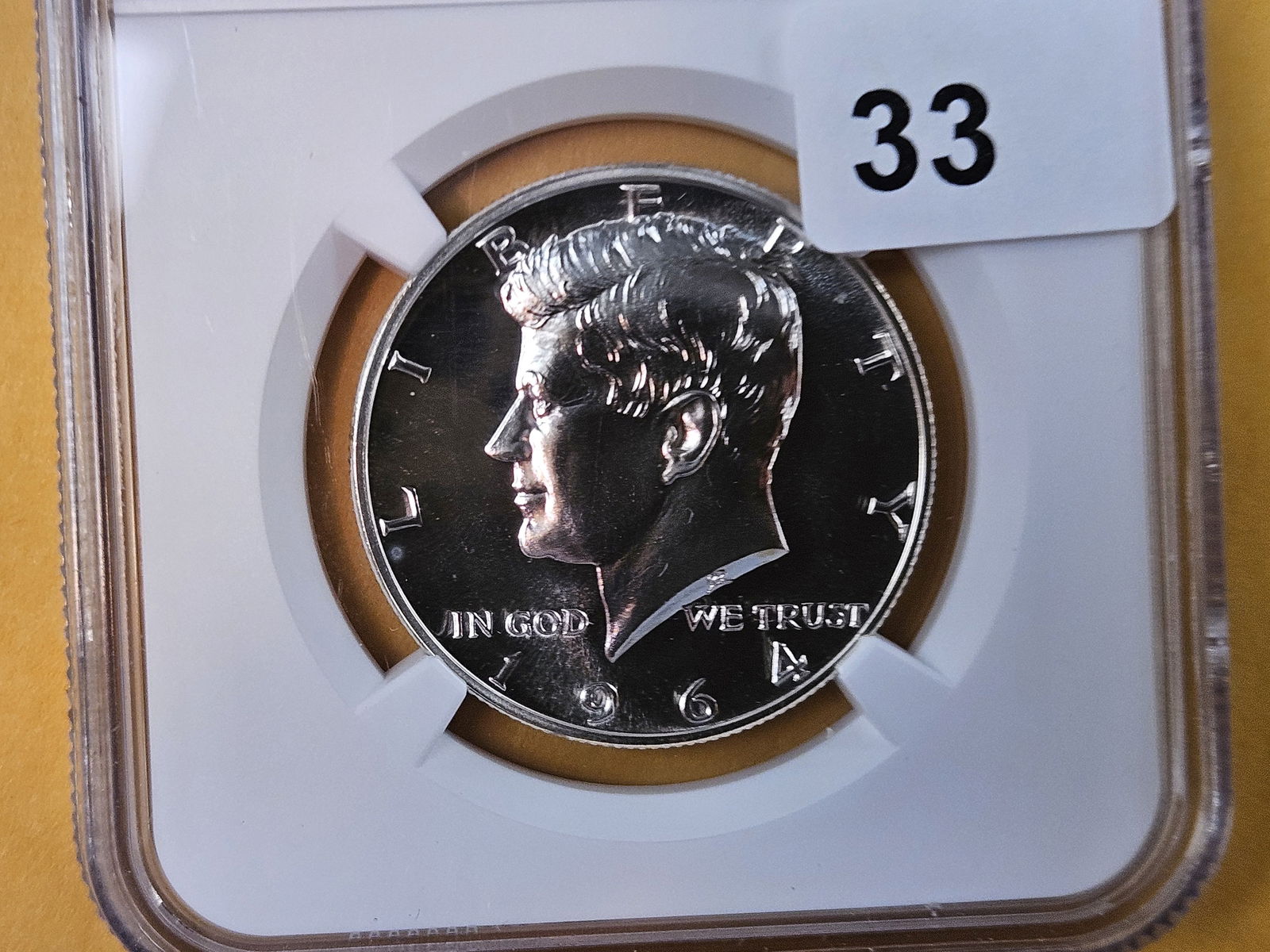 NGC 1964 silver Kennedy Half Dollar in Proof 67: Superb Gem!