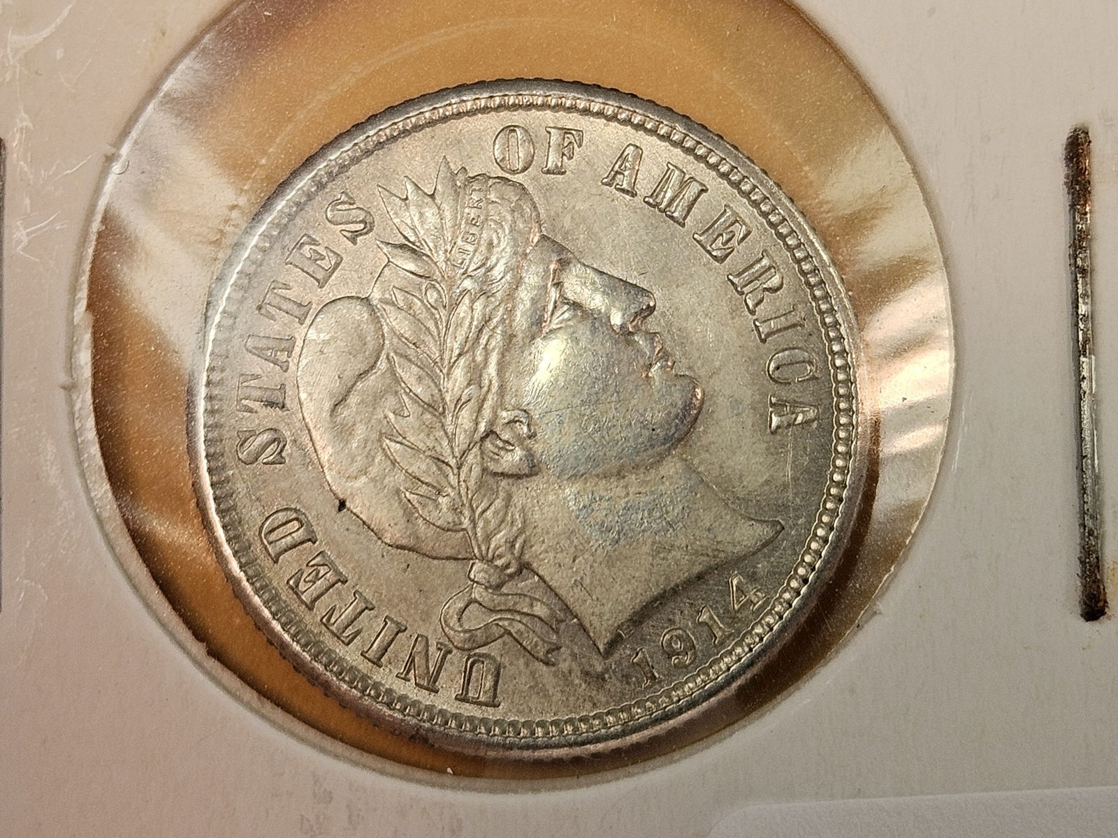 Choice About Uncirculated plus 1914 silver Barber Dime: Possibly an old cleaning? 
