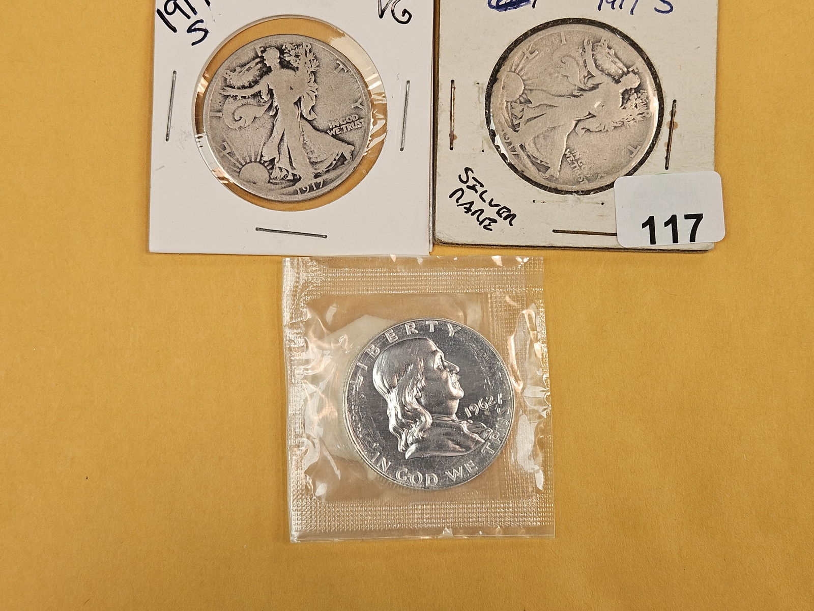Three mixed silver half dollars - 2