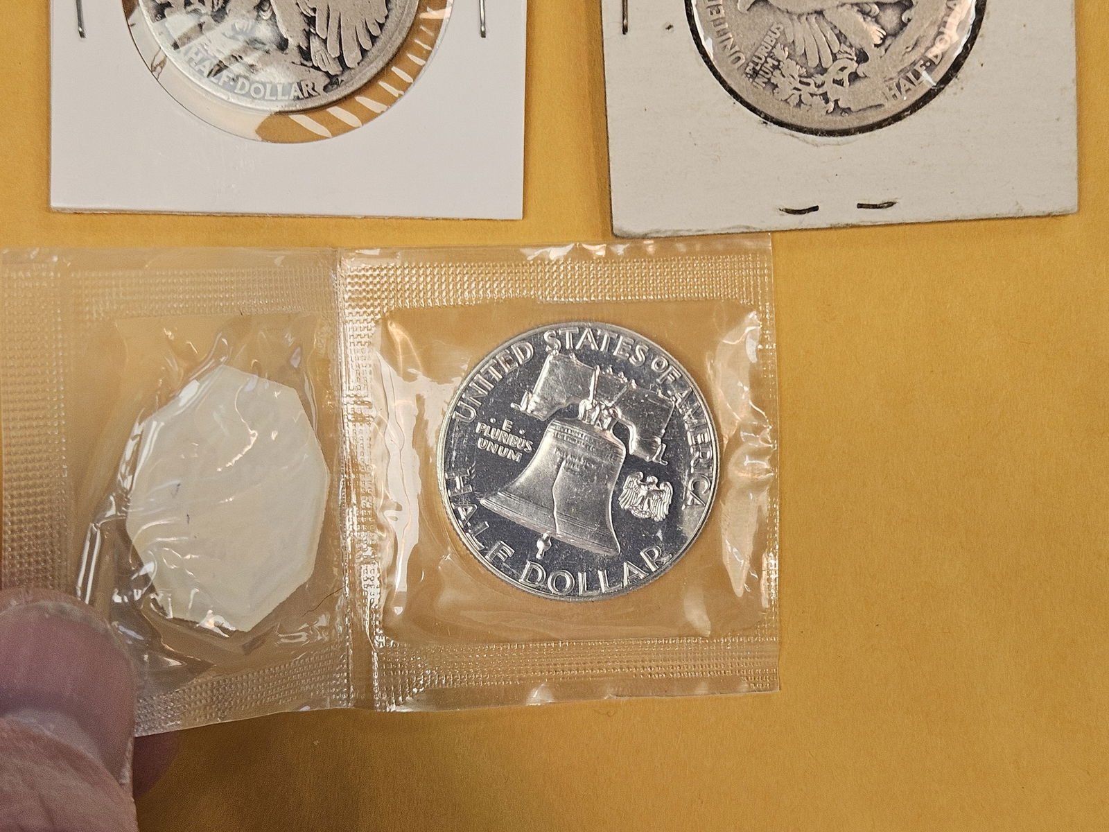 Three mixed silver half dollars - 4