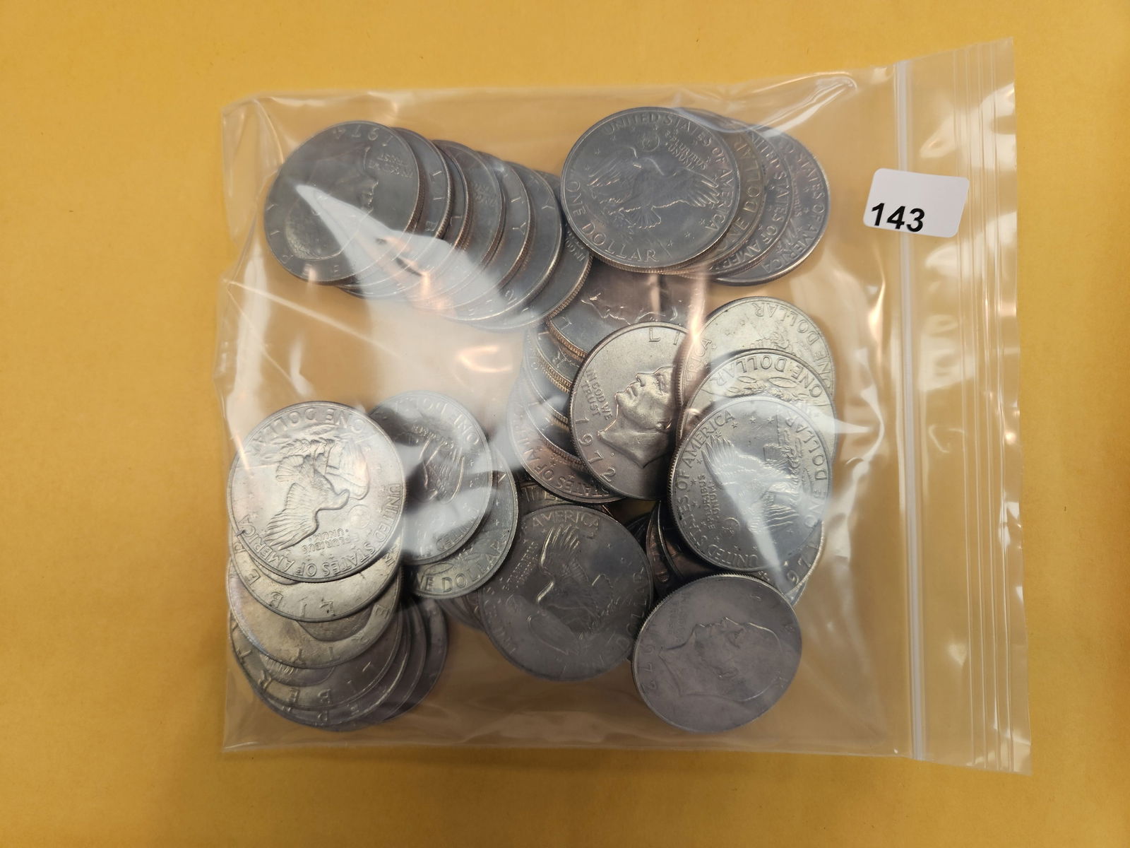 Forty Eisenhower Dollars: Mixed dates and grades 