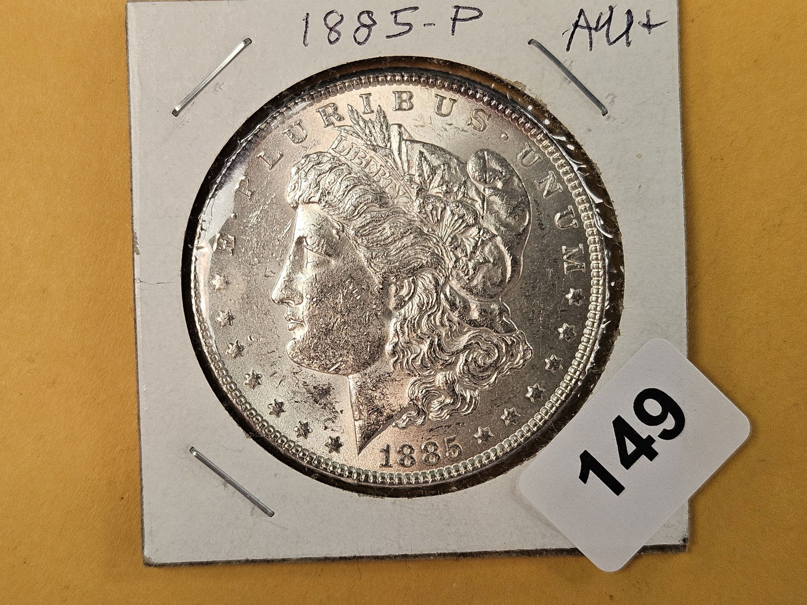 Choice Brilliant About Uncirculated plus 1885 Morgan Dollar: Light toning on the reverse 