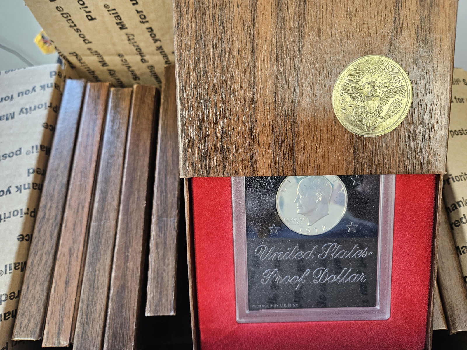 Fifteen SILVER Brown IKE Eisenhower Silver Dollars: All in BROWN GSA packaging. Probably duplicates. Ships separately in a Flat Rate Medium Box. No combined shipping 