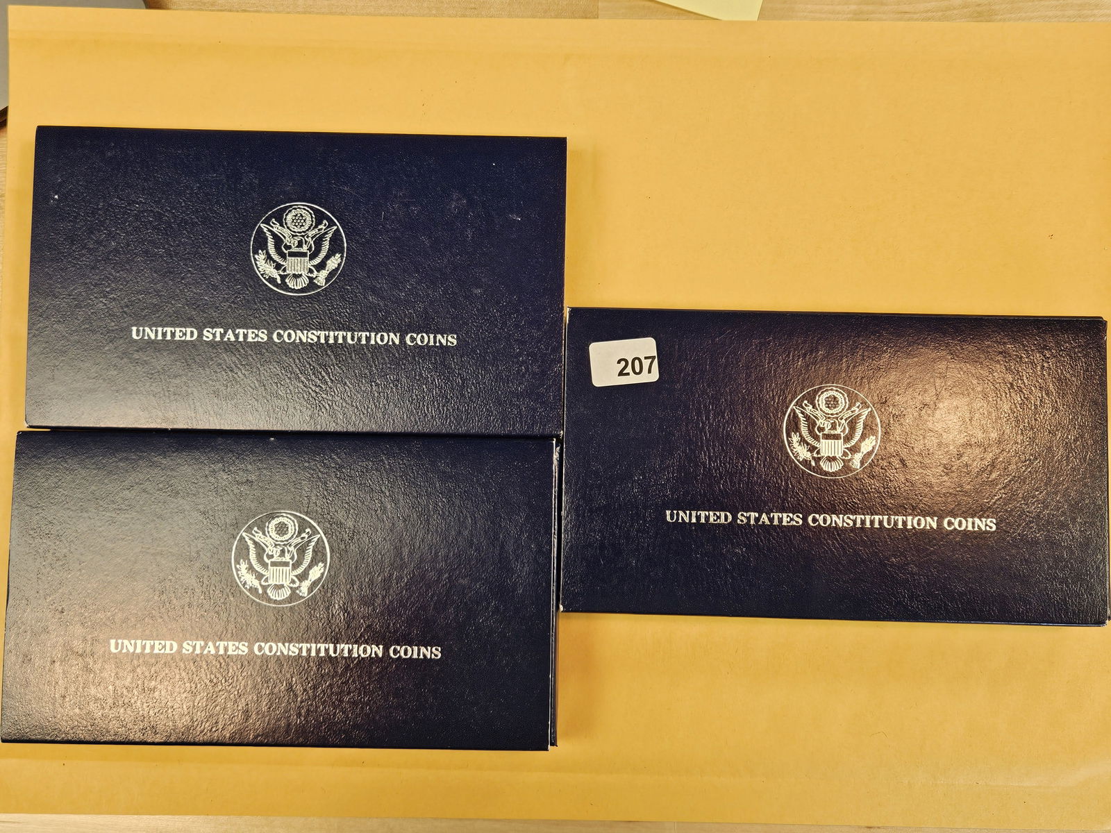 Three GEM Proof Deep Cameo 1987 Commemorative Silver Dollar Sets: In original government packaging with certificate of authenticity 