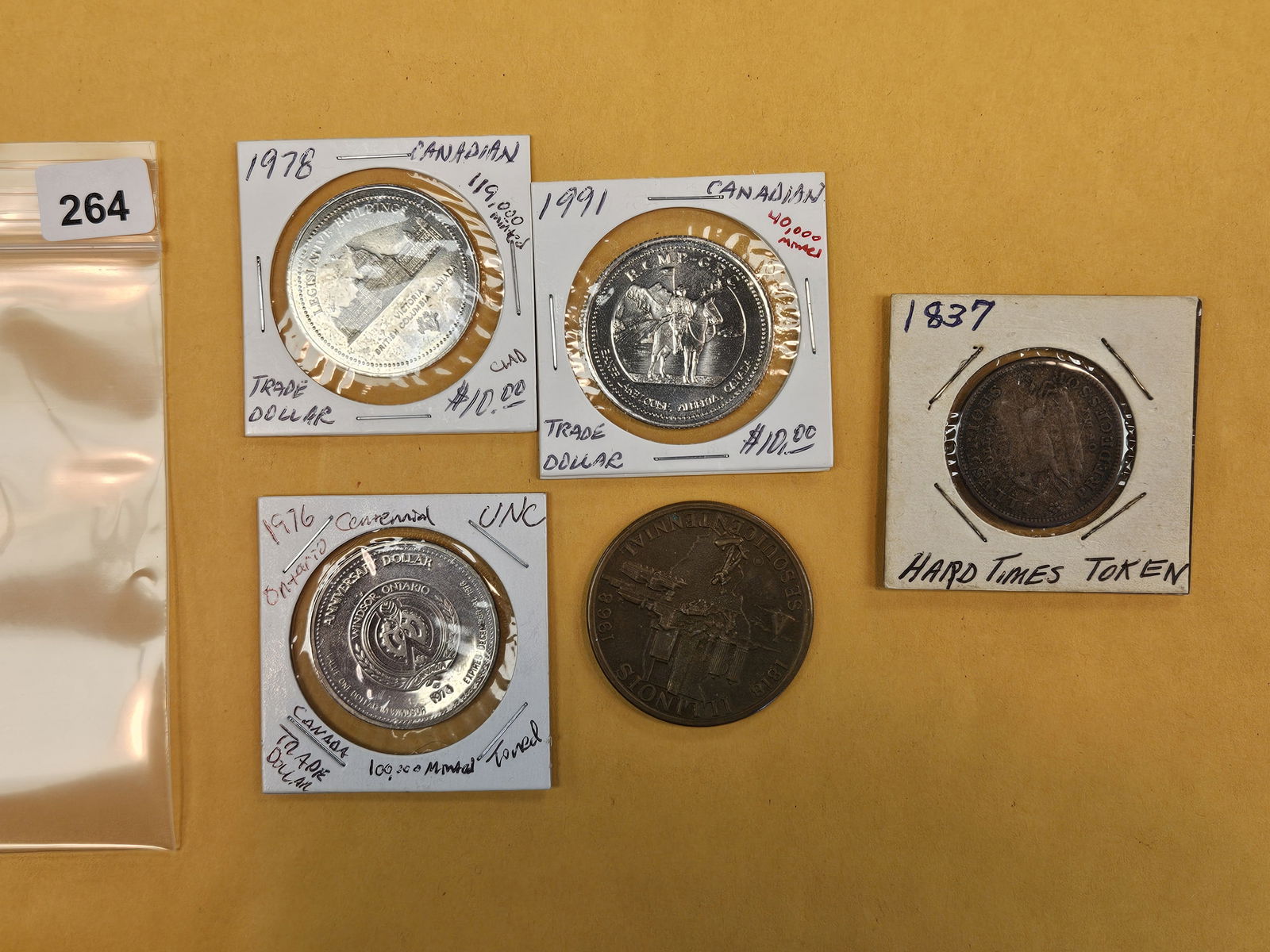 Five interesting mixed pieces: Three Canadian Trade Dollars, Illinois medal and a 1837 Hard Times Token 
