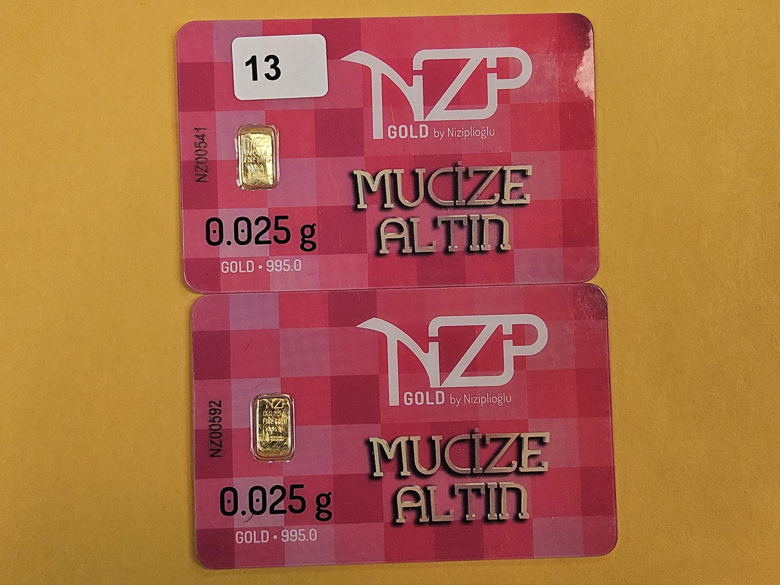 GOLD! Two NZP Turkey .995 fine gold bars in Assay Holders: By Niziplioglu. Weighs .025 grams each