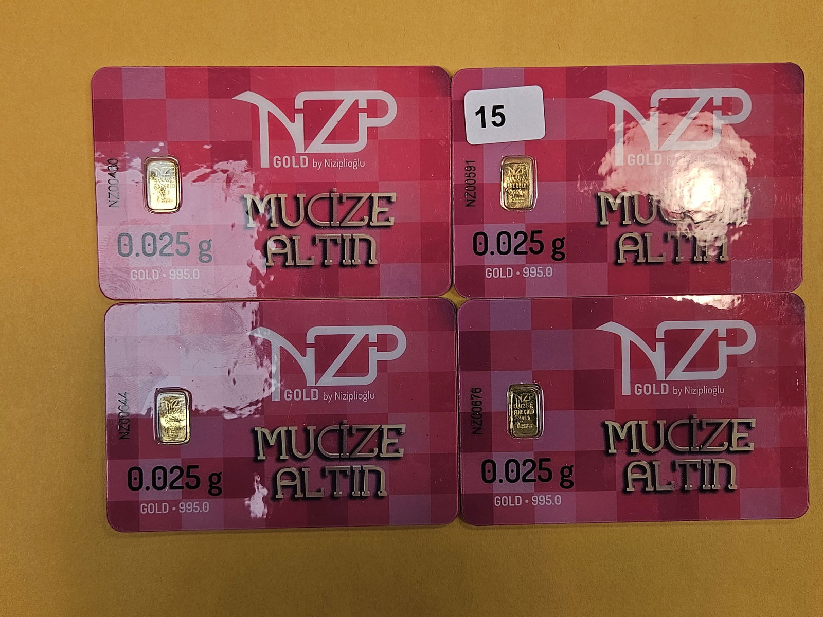 GOLD! Four NZP Turkey .995 fine gold bars in Assay Holders: By Niziplioglu. Weighs .025 grams each