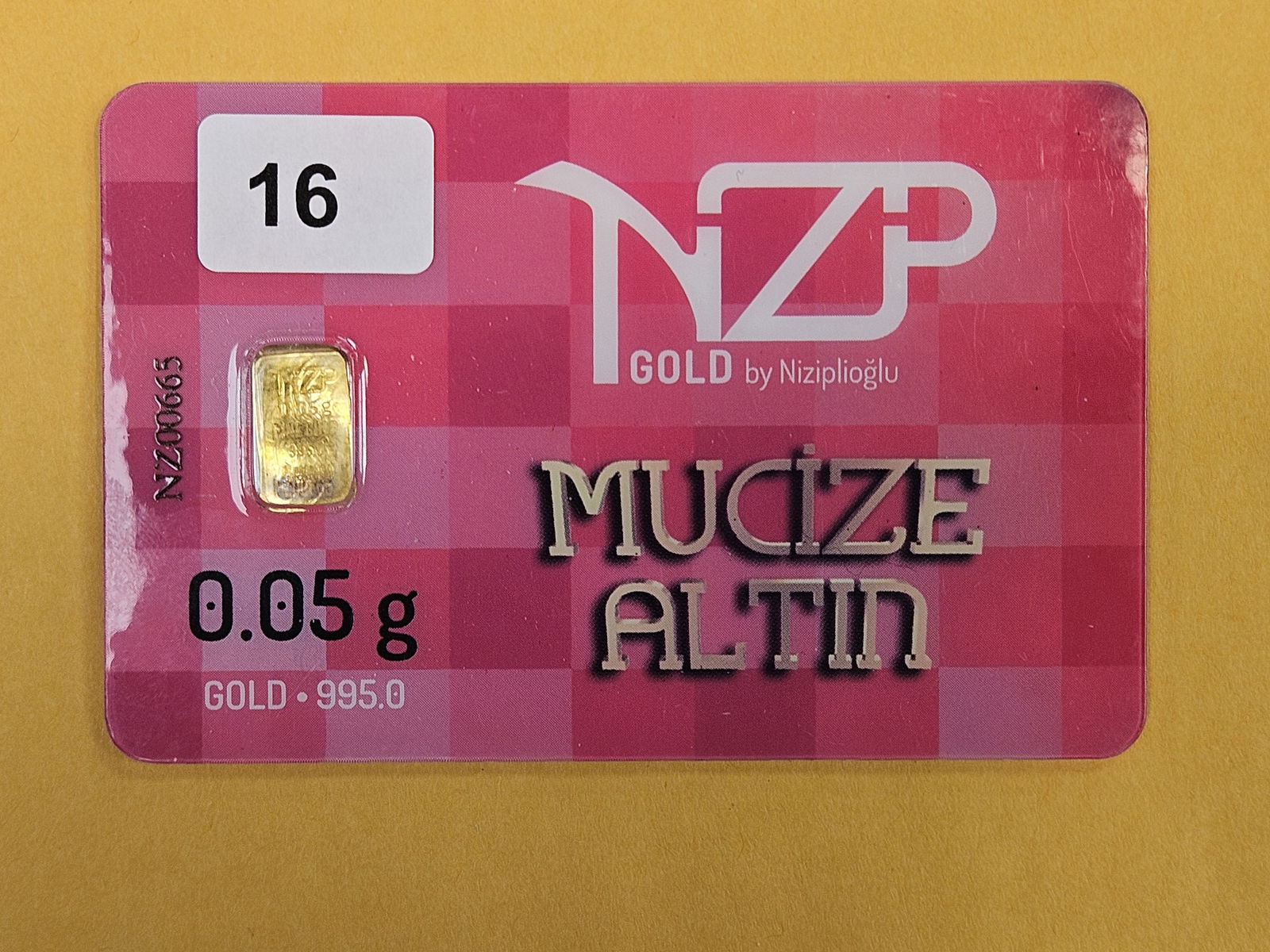 GOLD! NZP Turkey .995 fine gold bar in Assay Holder: By Niziplioglu. Weighs .05 grams