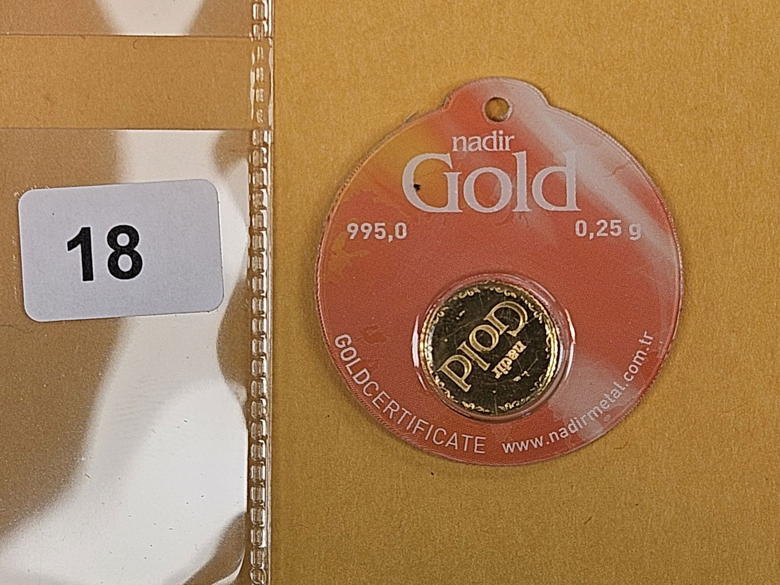 GOLD! NADIR Gold .995 Gold bar in Assay Holder: From Nadir metals. Weighs .25 grams