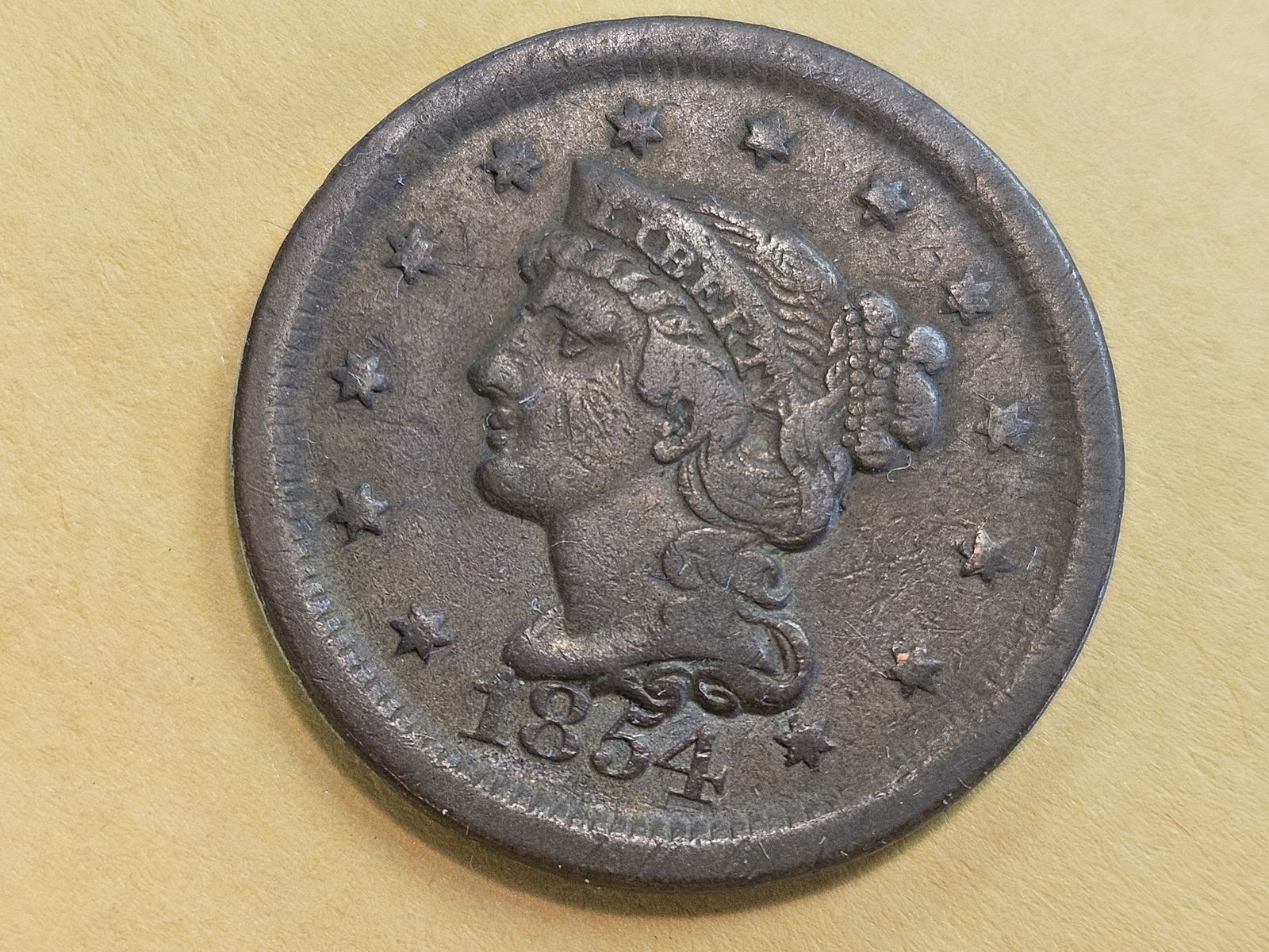 1854 Braided Hair Large Cent in Very Fine: Light brown color. Worn die