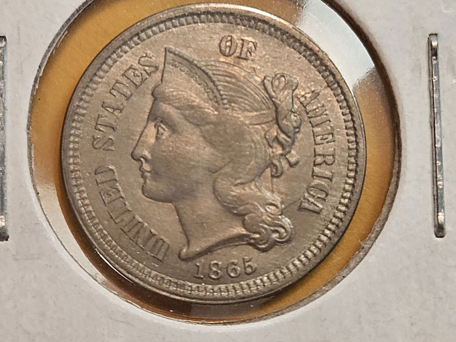 1865 Three Cent Nickel in Bright About Uncirculated - 58: Has some cool die clashes and lovely die breaks 