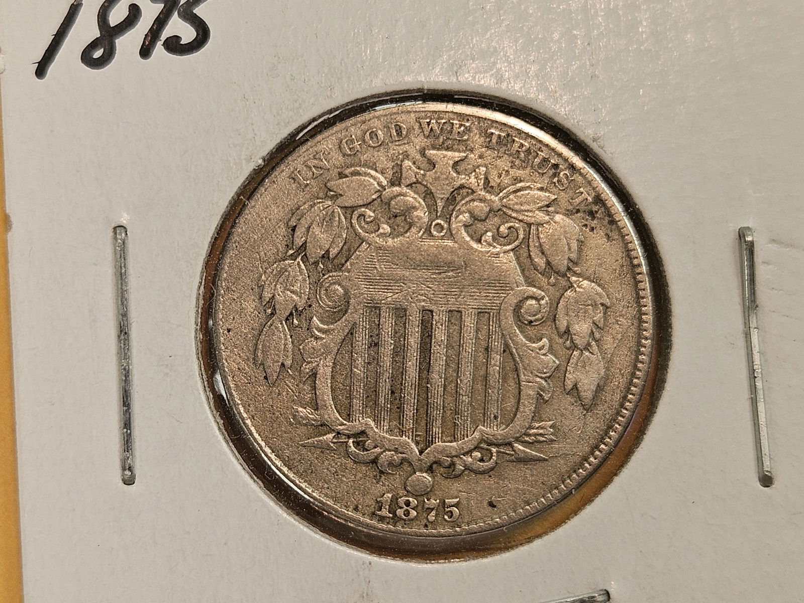 Better 1875 Shield Nickel in Fine plus to Very Fine: Has what looks like die adjustment marks in the top left of the obverse 