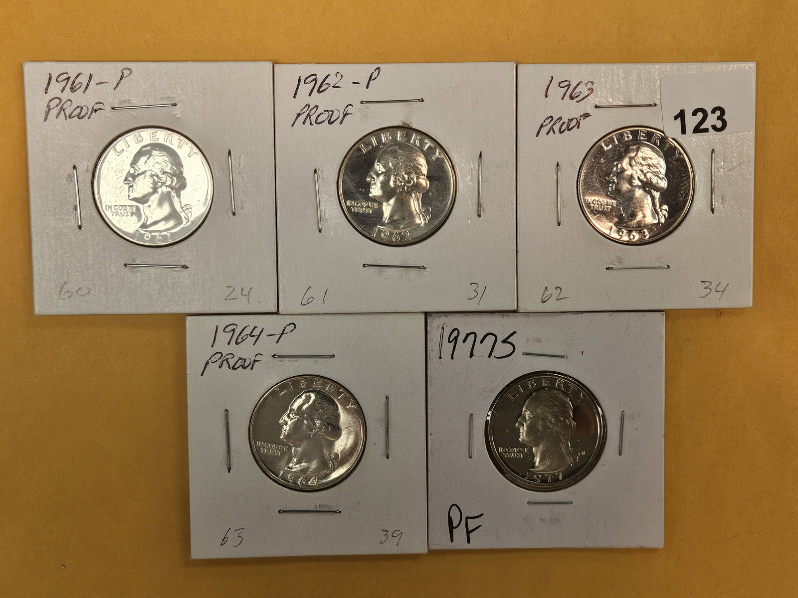 Five mixed Proof Washington Quarters: Four are silver 