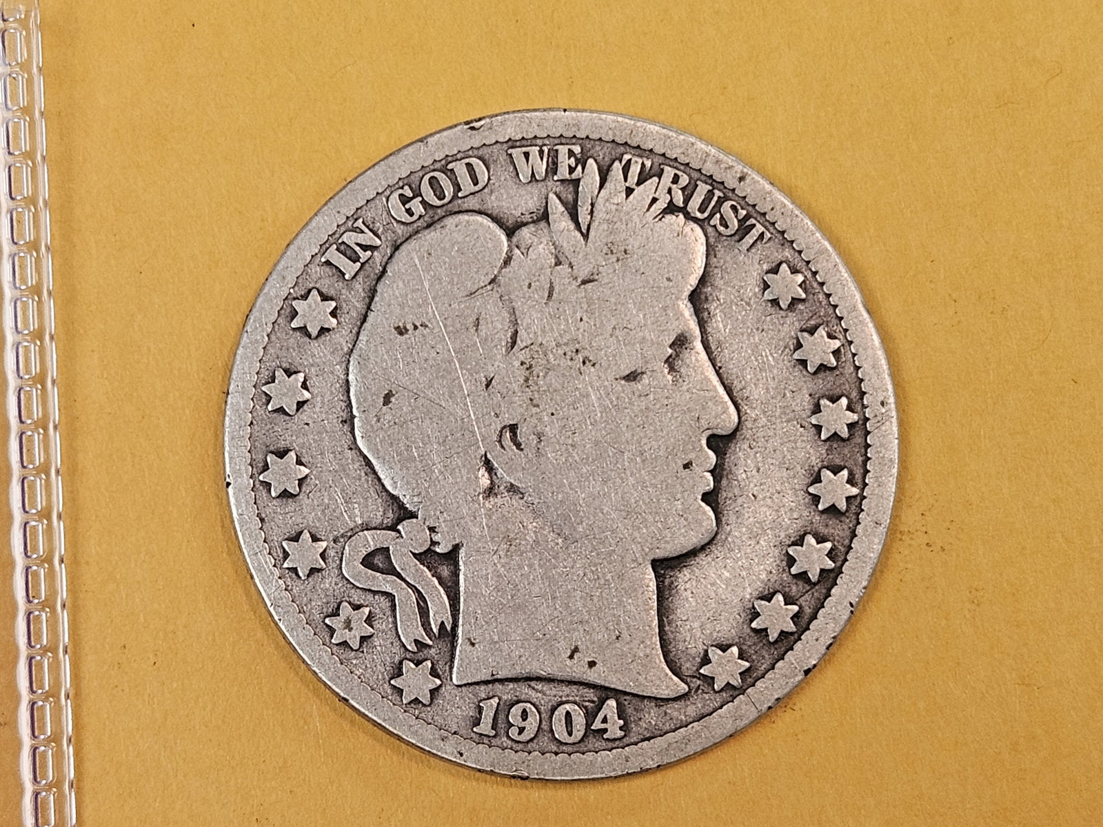 Better Date 1904-O Barber silver Half Dollar in Very Good: Full rims. Strong on obverse, there, just weaker, on the reverse 