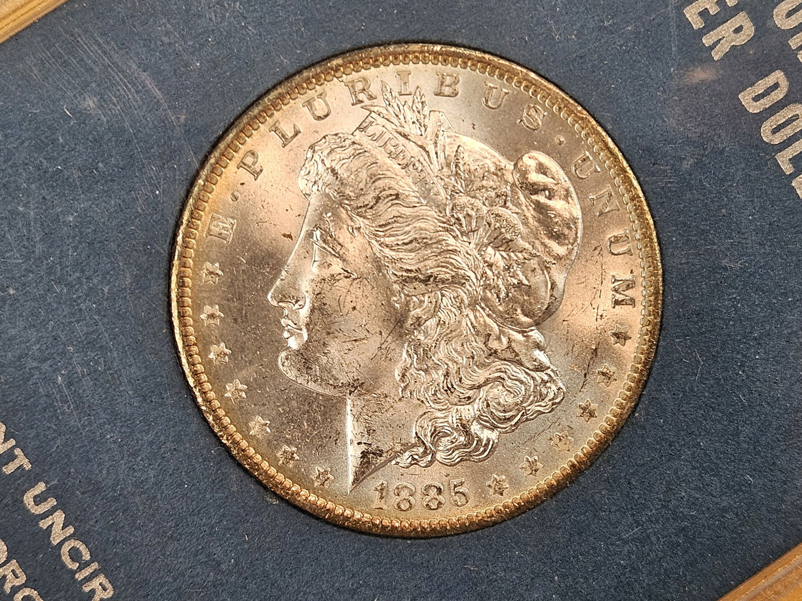 Choice Brilliant Uncirculated 1885-O Morgan Silver Dollar: In nice capital plastics holder