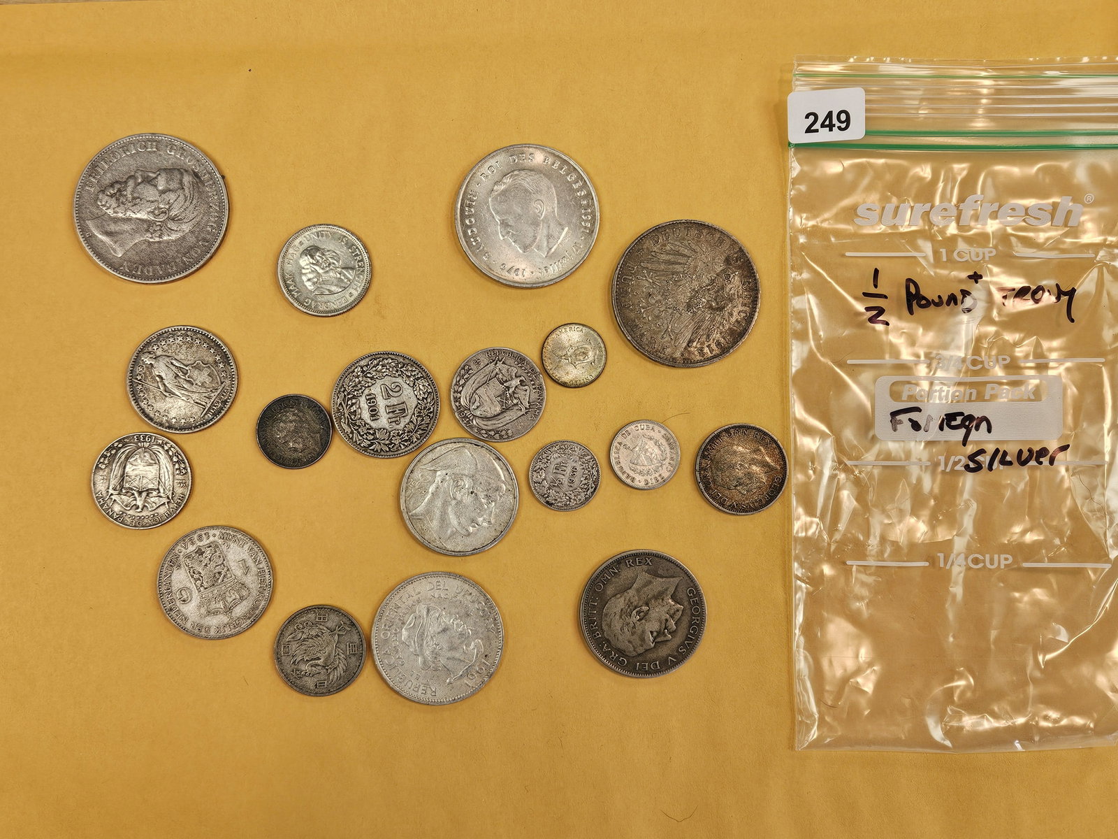Bag of Silver World Coins: From dealer. Unauthenticated by us. Just know they're silver