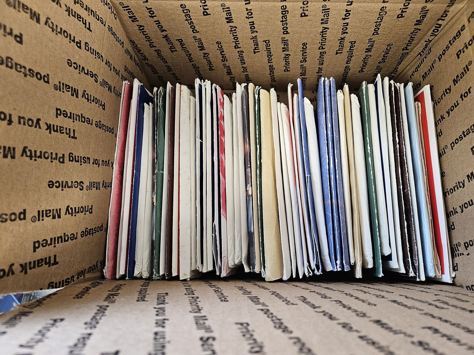 Fifty mixed US Mint Sets in OGP: Ships separately in a Flat Rate Medium Box. Mixed. Duplicates