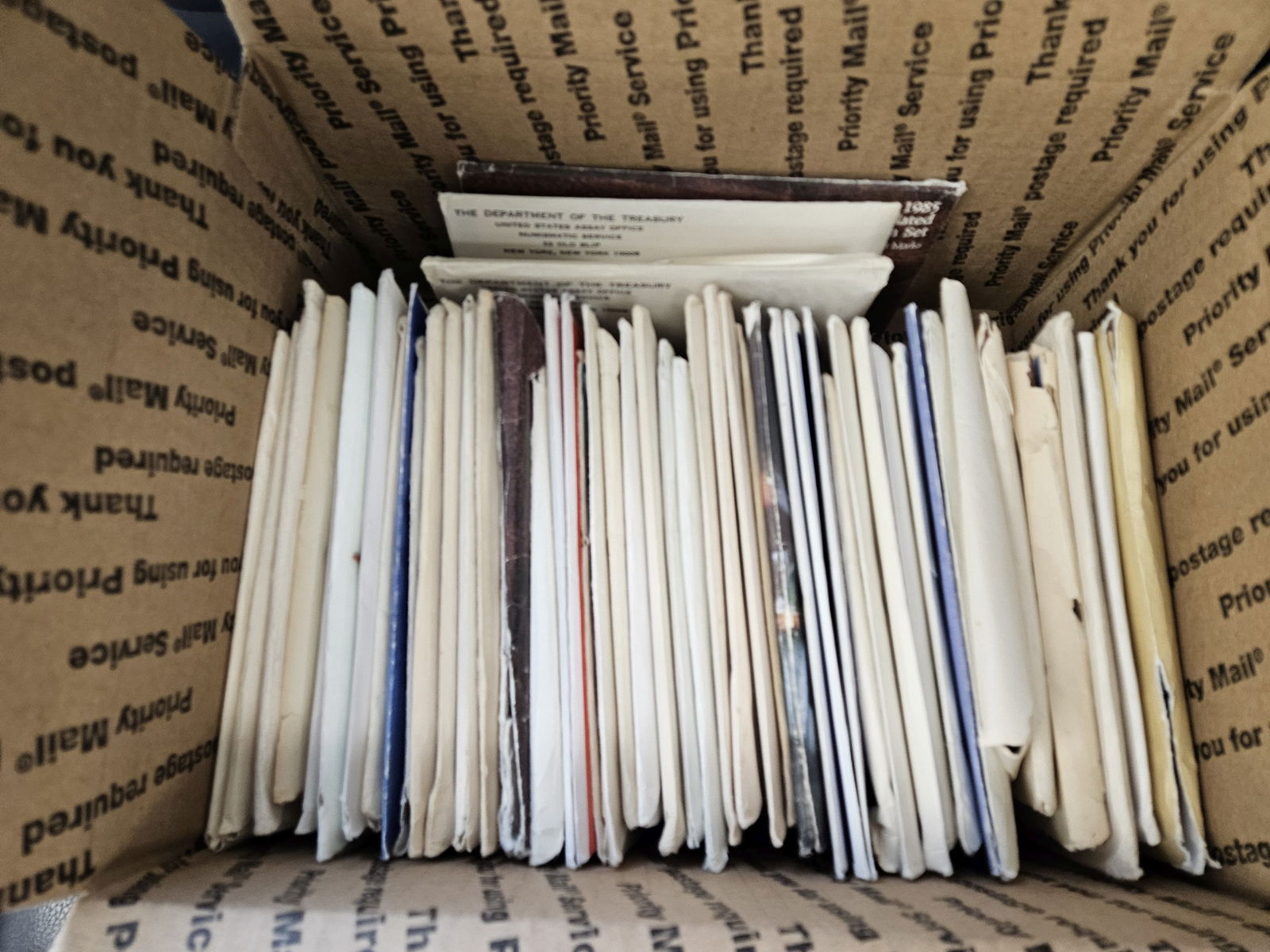 Fifty mixed US Mint Sets in OGP: Ships separately in a Flat Rate Medium Box. Mixed. Duplicates 