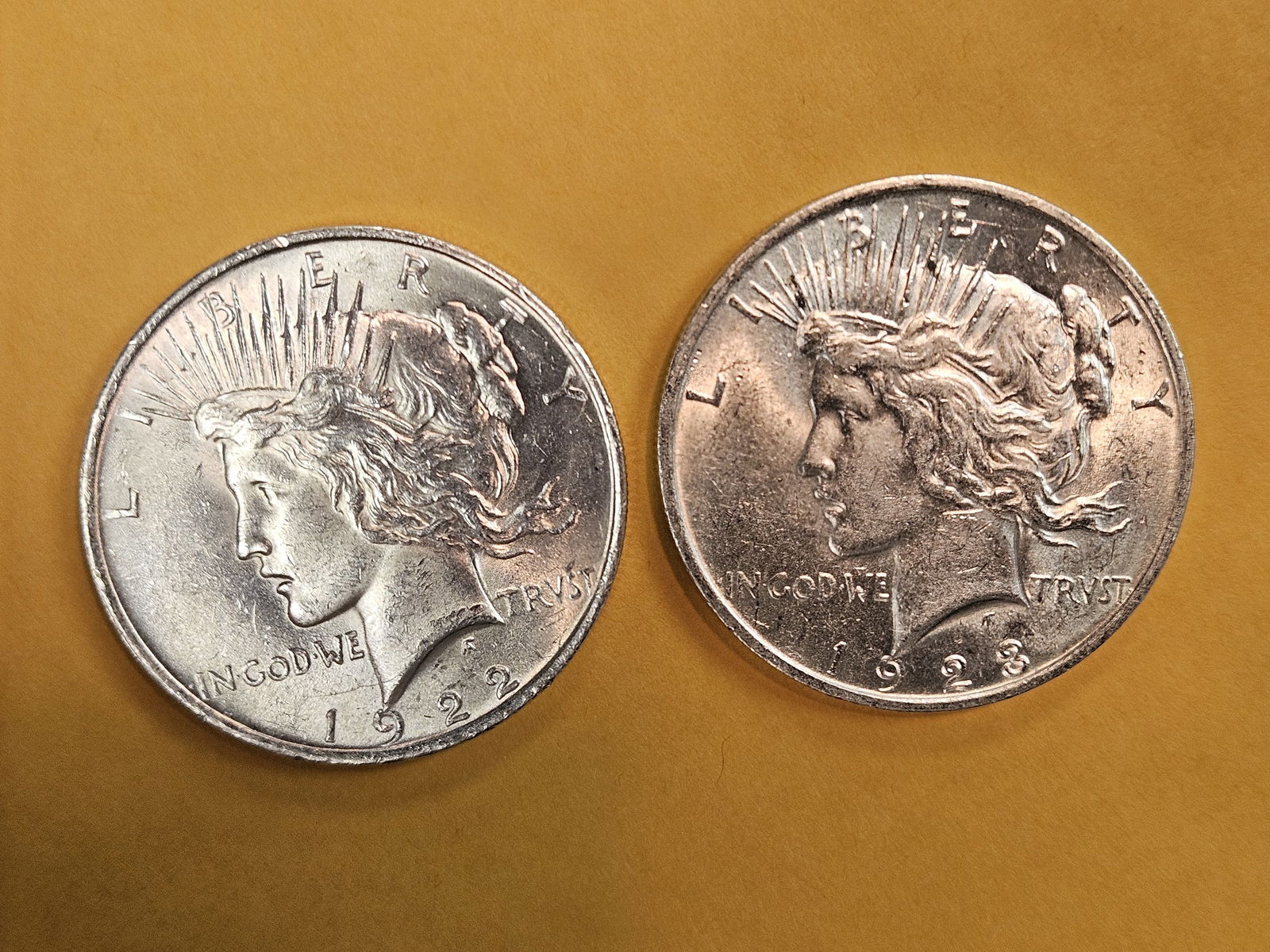 Two Brilliant AU-BU Peace Silver Dollars: 1922 and 1923