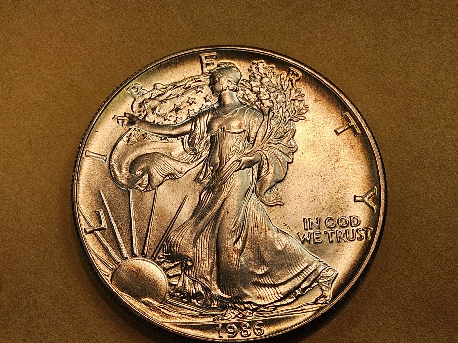 ** KEY DATE ** GEM Brilliant Uncirculated 1986 American Silver Eagle: Gorgeous album toning! 