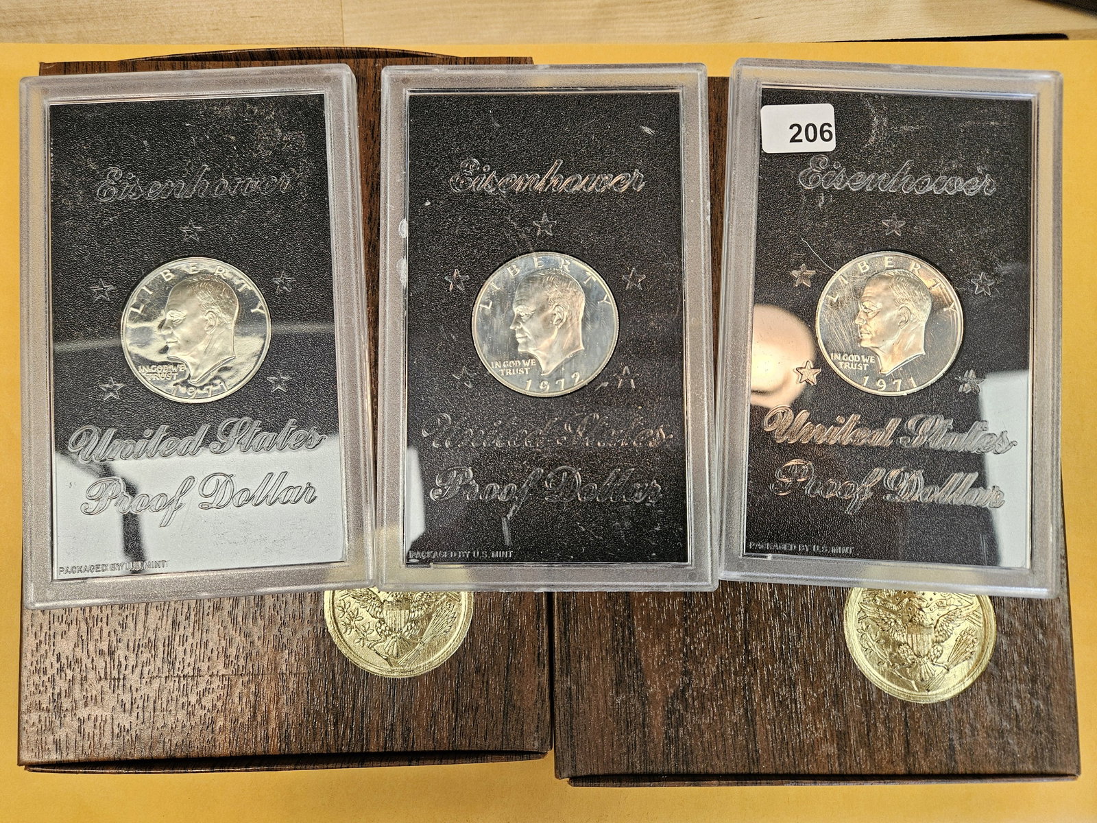 Five GEM Proof Silver BROWN IKE Silver Dollars: Silver Eisenhowers. Three in GSA Hard packs & original brown boxes. No coas 