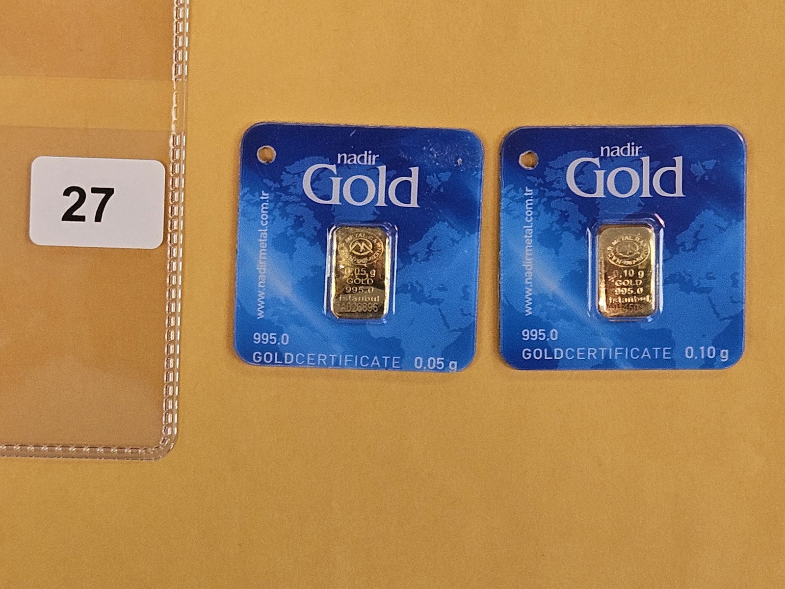 GOLD! Two Nadir .1 Gram .9999 fine gold bars: In assay holders 