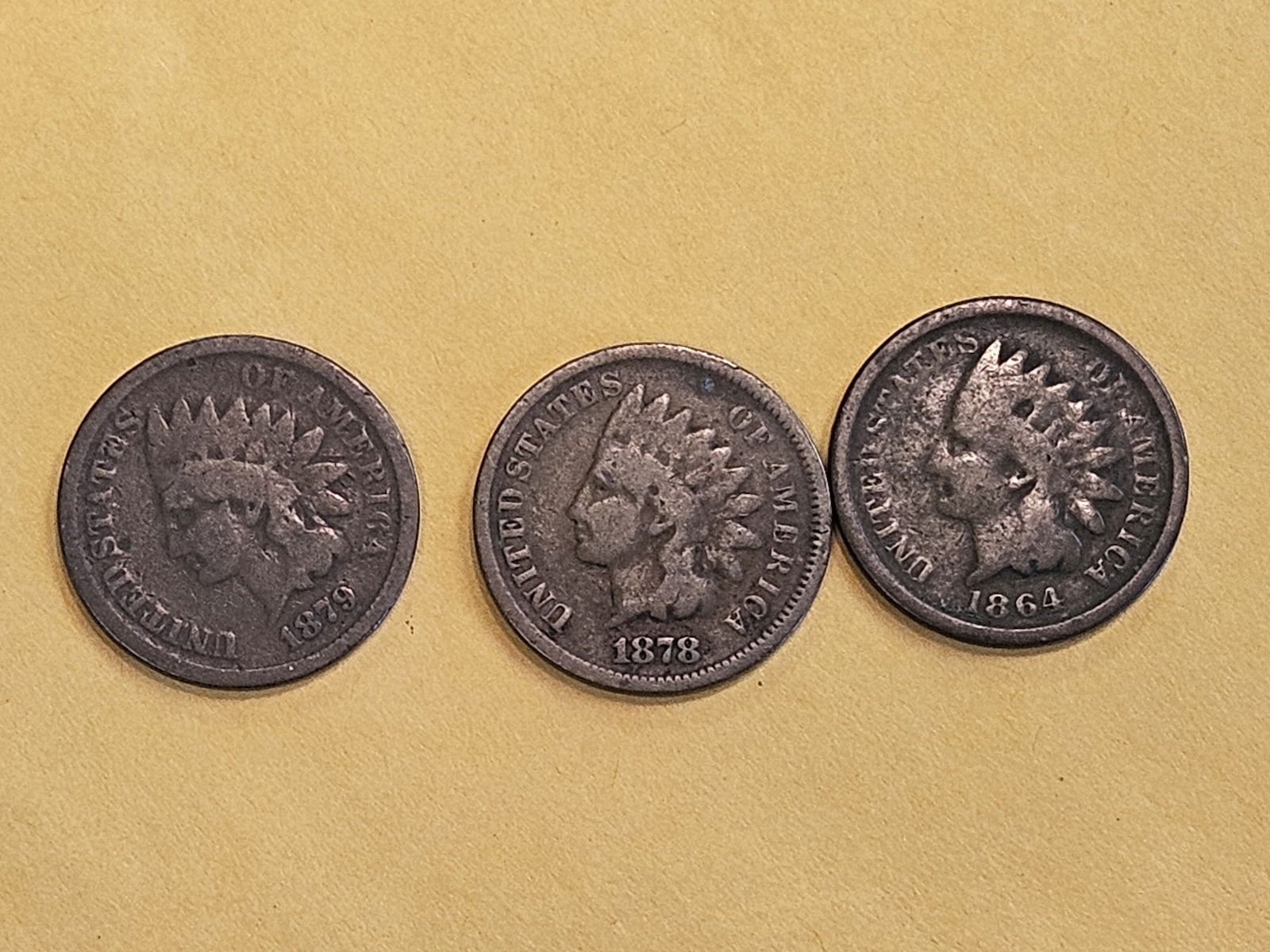 Three little better date Indian Cents in Very Good: 1864, 1878 and 1879