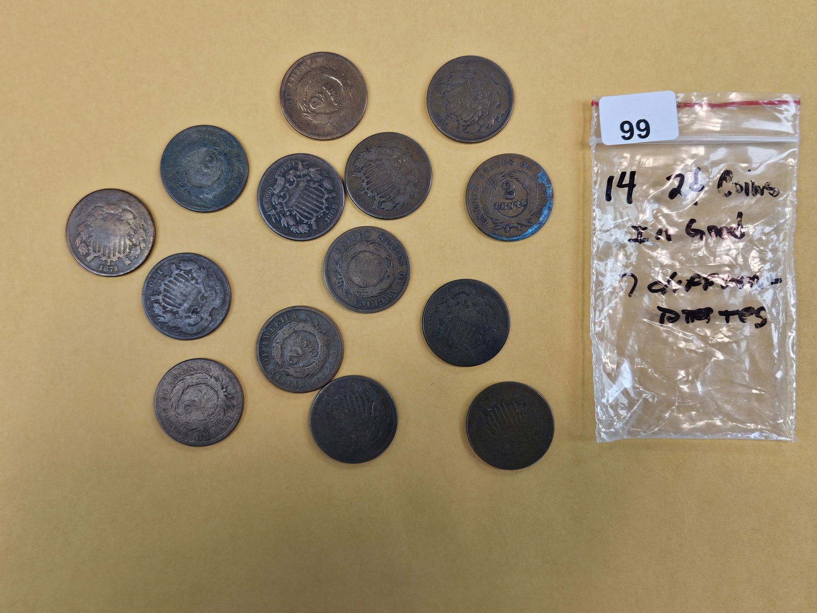 Fourteen 2-cent pieces in Good: Seven total different dates 
