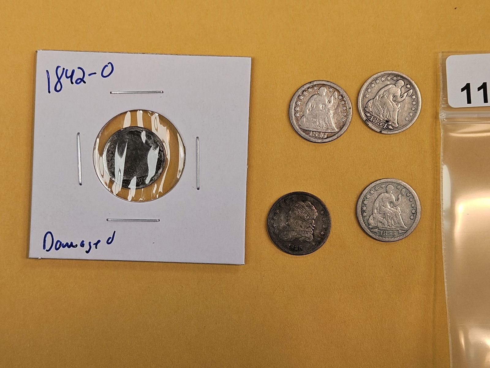 Five mixed silver Half-Dimes: 1835 Bust, Semi-Key 1842-O (damaged) and the rest are Seated Liberty