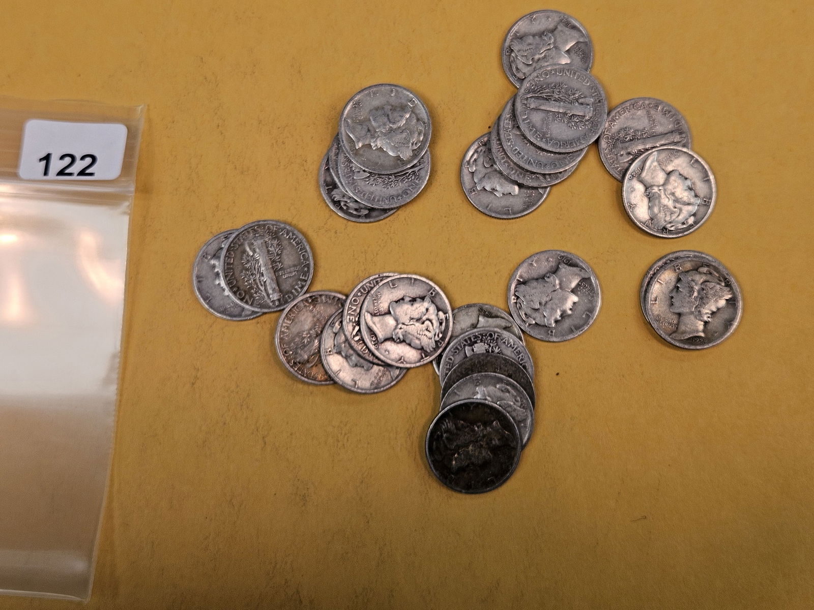 Twenty-five mixed silver Mercury Dimes: Circulated 