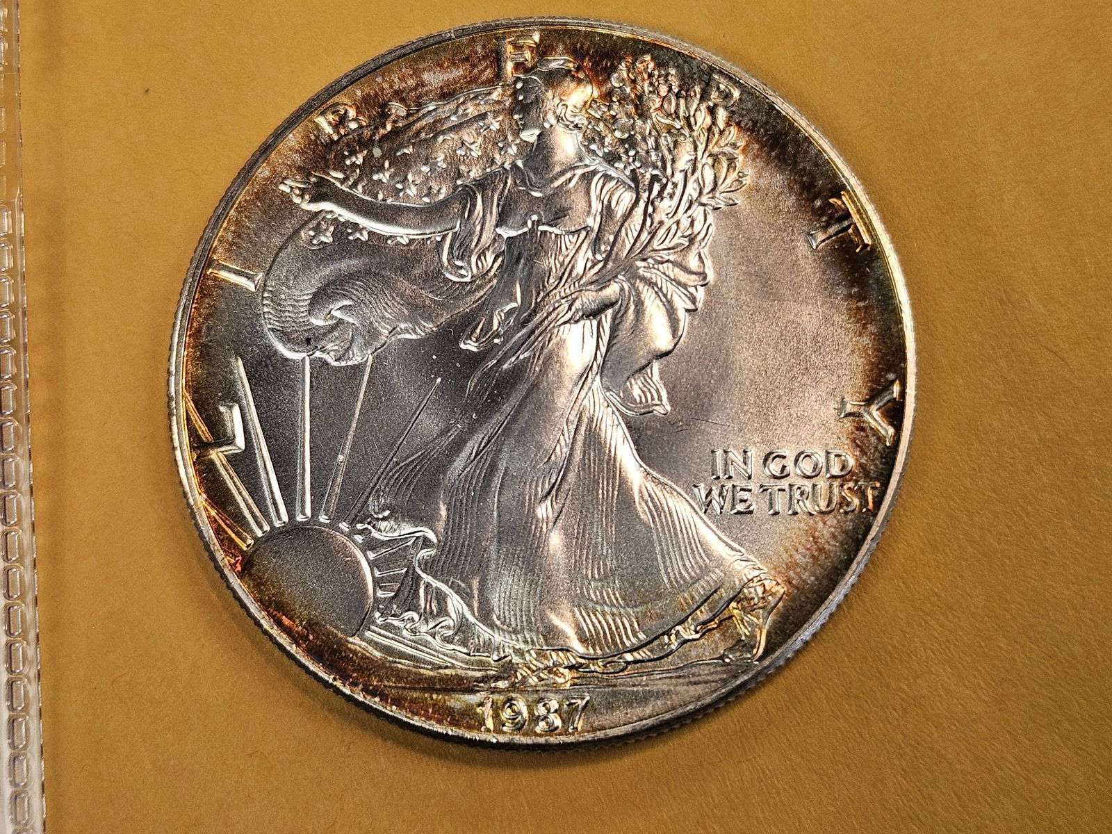 GEM Brilliant Uncirculated 1987 American Silver Eagle: Album toning 