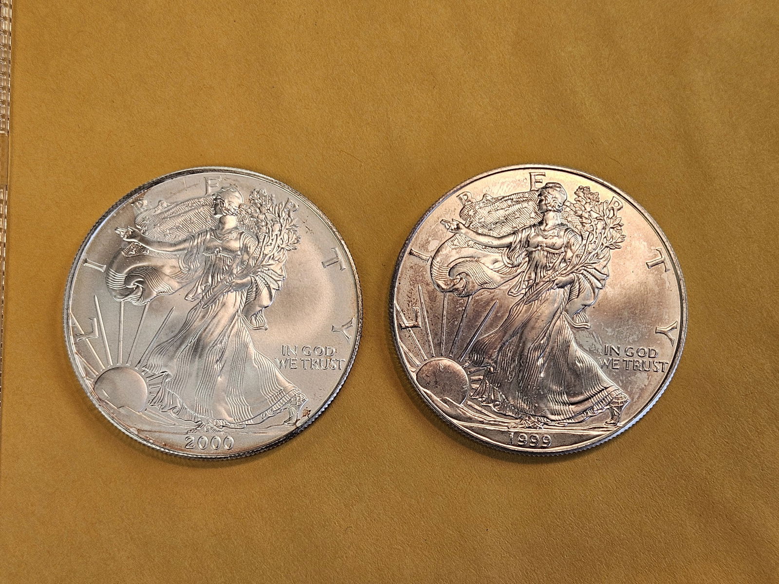 Two GEM Brilliant Uncirculated American silver Eagles: 2000 and 1999 