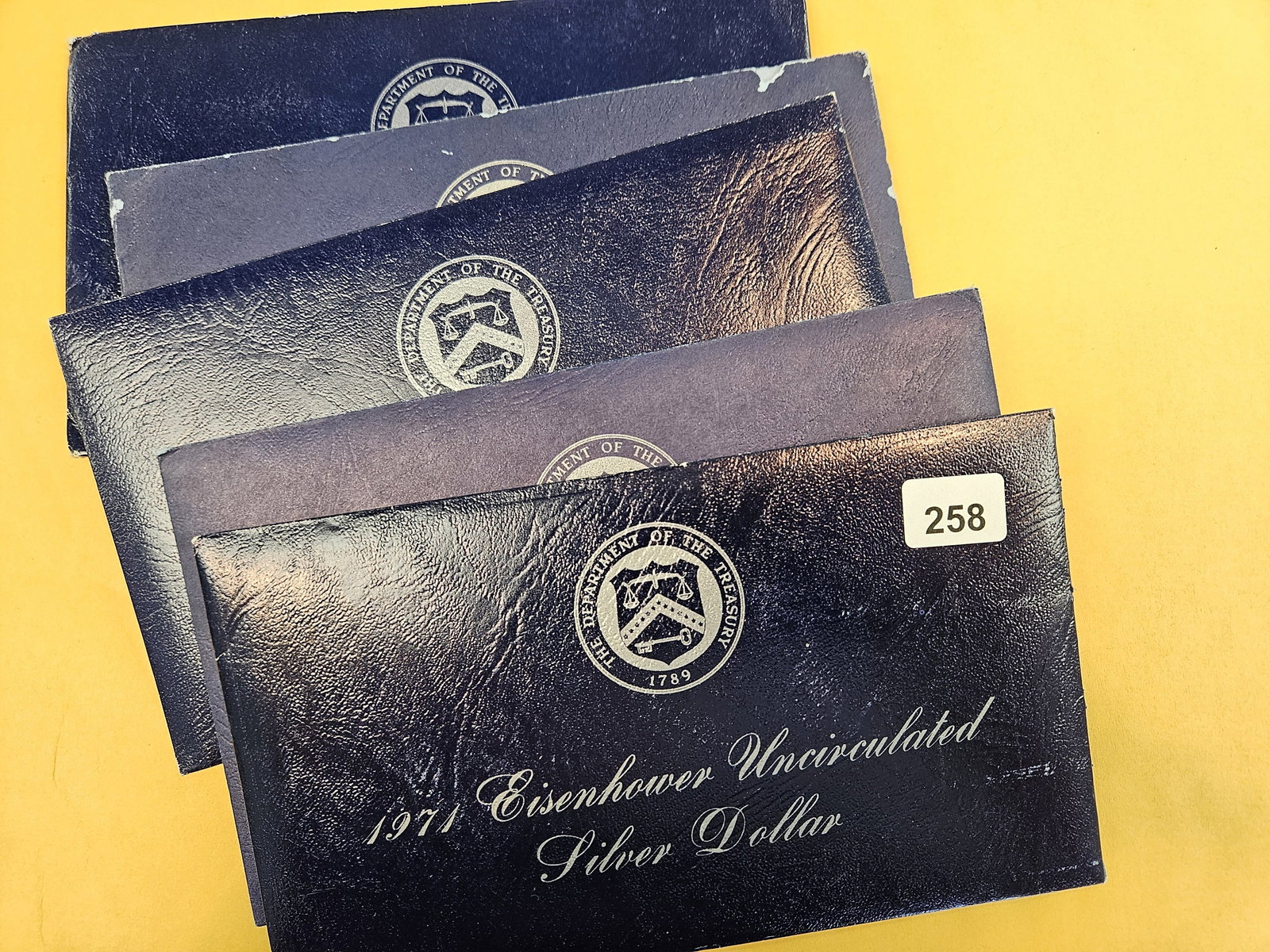 Five GEM Brilliant Uncirculated SILVER Blue Ikes: Silver Eisenhower Dollars in Blue envelopes. In original blister packs